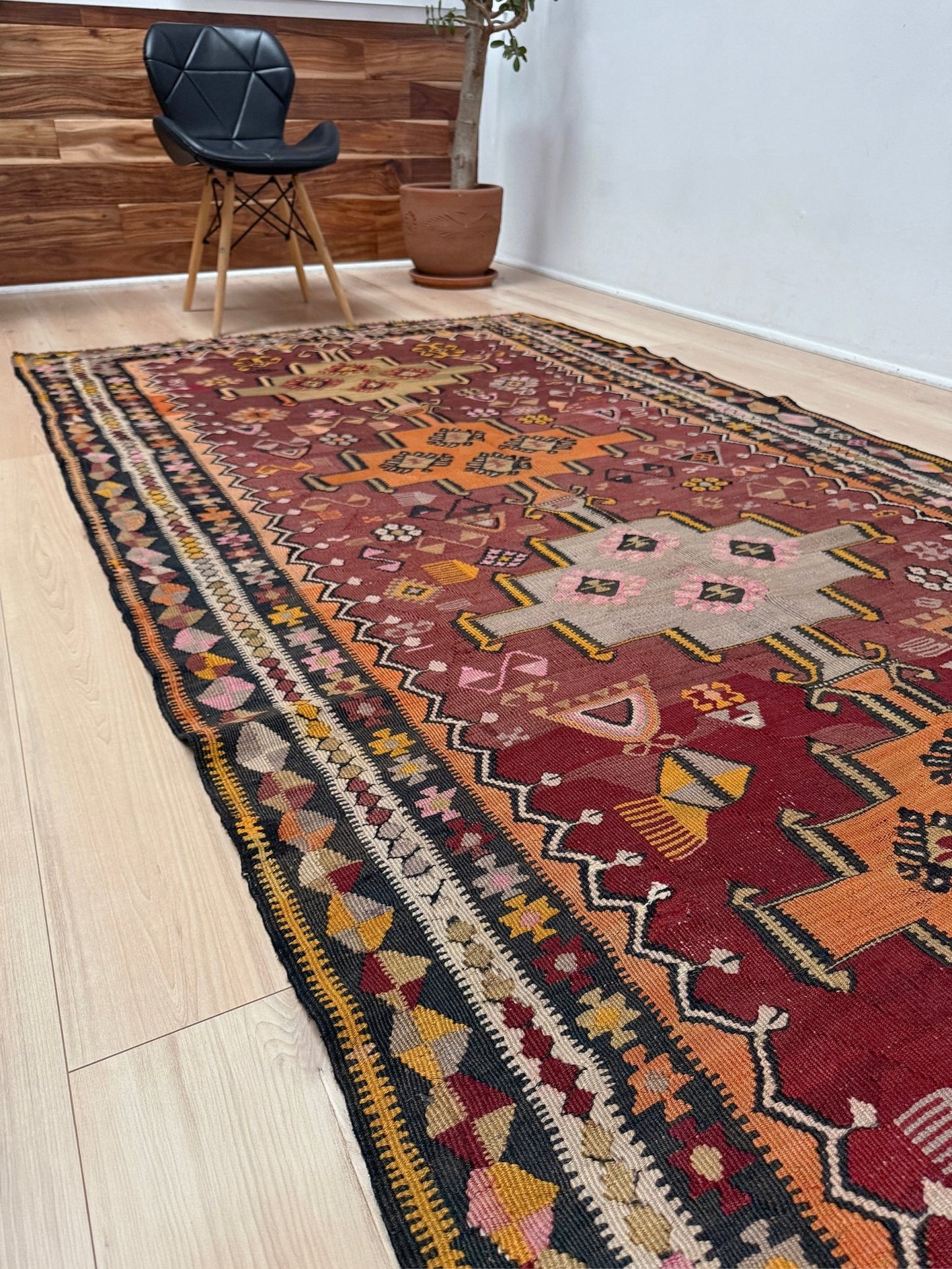Vintage Kurdish Kars kilim, featuring maroon red and chestnut brown field, geometric medallions, symbolic tribal motifs and protective symbols, handwoven wool 5x10 flatweave rug 