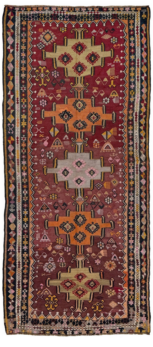 Vintage Kurdish Kars kilim, featuring maroon red and chestnut brown field, geometric medallions, symbolic tribal motifs and protective symbols, handwoven wool 5x10 flatweave rug 