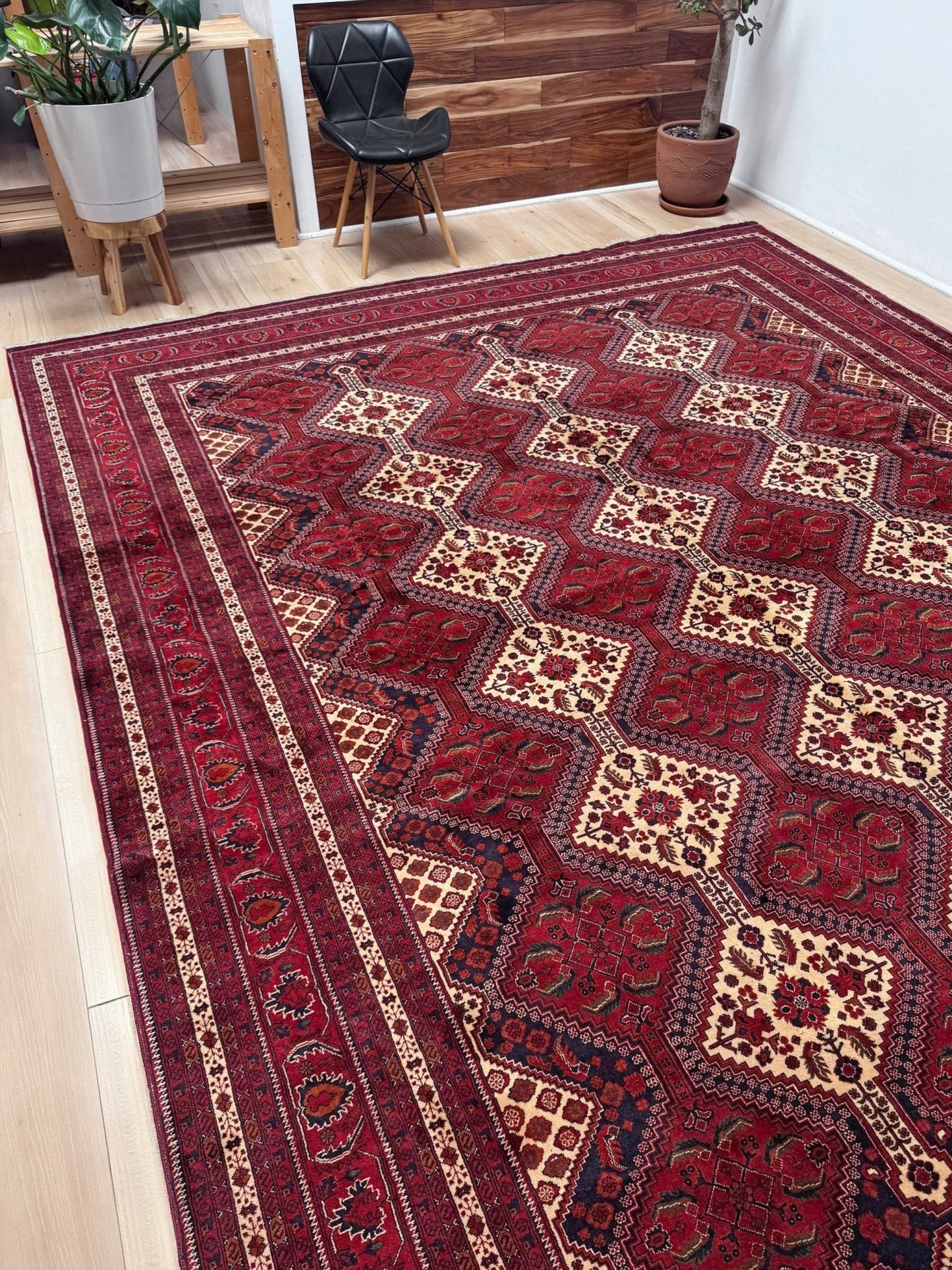 Deep crimson Khal Mohammadi Afghan rug with classic Turkmen gul medallions, dark navy border, ivory details, burgundy, terracotta, beige and forest green accents, handmade Merino wool 10x14 from Indigo Rugs Burlingame Bay Area.