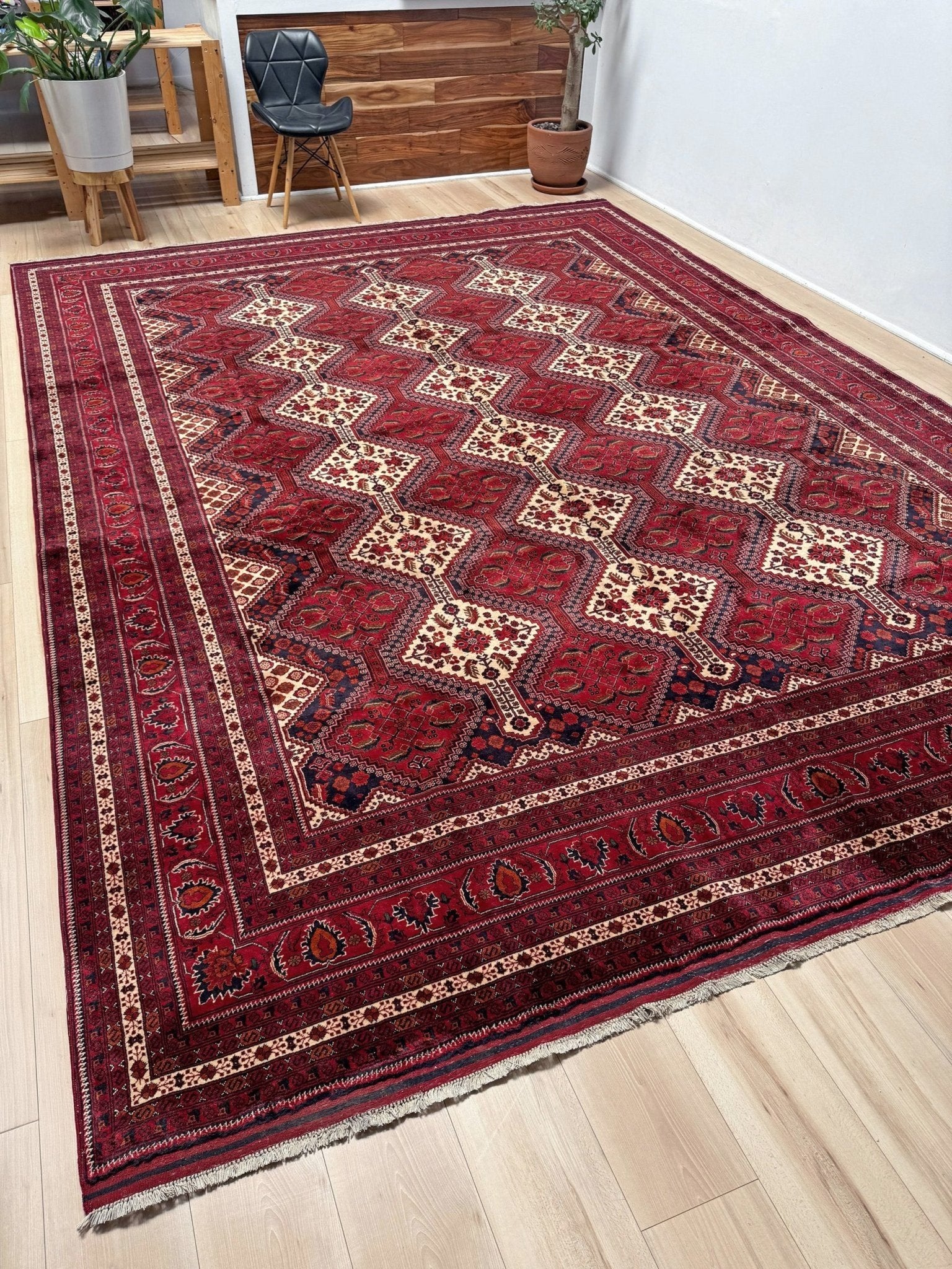 Deep crimson Khal Mohammadi Afghan rug with classic Turkmen gul medallions, dark navy border, ivory details, burgundy, terracotta, beige and forest green accents, handmade Merino wool 10x14 from Indigo Rugs Burlingame Bay Area.