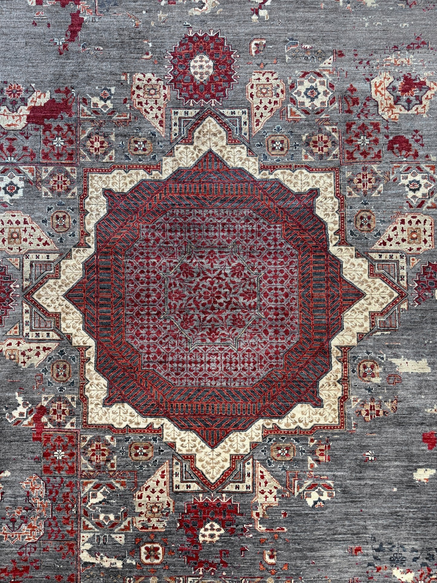 Transitional erased modern Mamluk design rug in 9x12 size with crimson medallion, silvery gray background, and ivory accents — perfect for living rooms, dining rooms, or bedrooms. Handmade wool rug from Indigo Rugs, Burlingame SF Bay Area with free shipping.