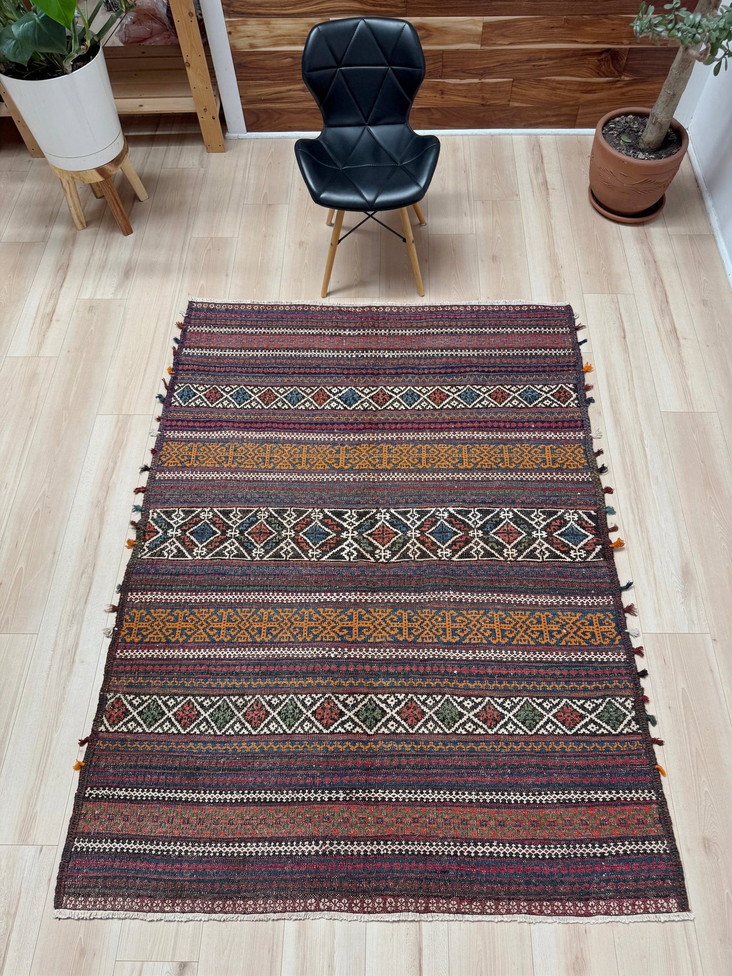 Vintage Persian tribal kilim rug with geometric horizontal bands, brick red, indigo blue, orange, decorative side tassels, handmade wool flatweave 5x6 from Indigo Rugs Burlingame Bay Area.