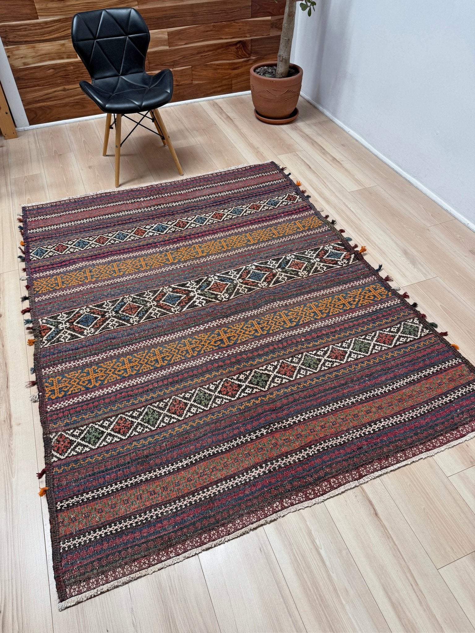 Vintage Persian tribal kilim rug with geometric horizontal bands, brick red, indigo blue, orange, decorative side tassels, handmade wool flatweave 5x6 from Indigo Rugs Burlingame Bay Area.