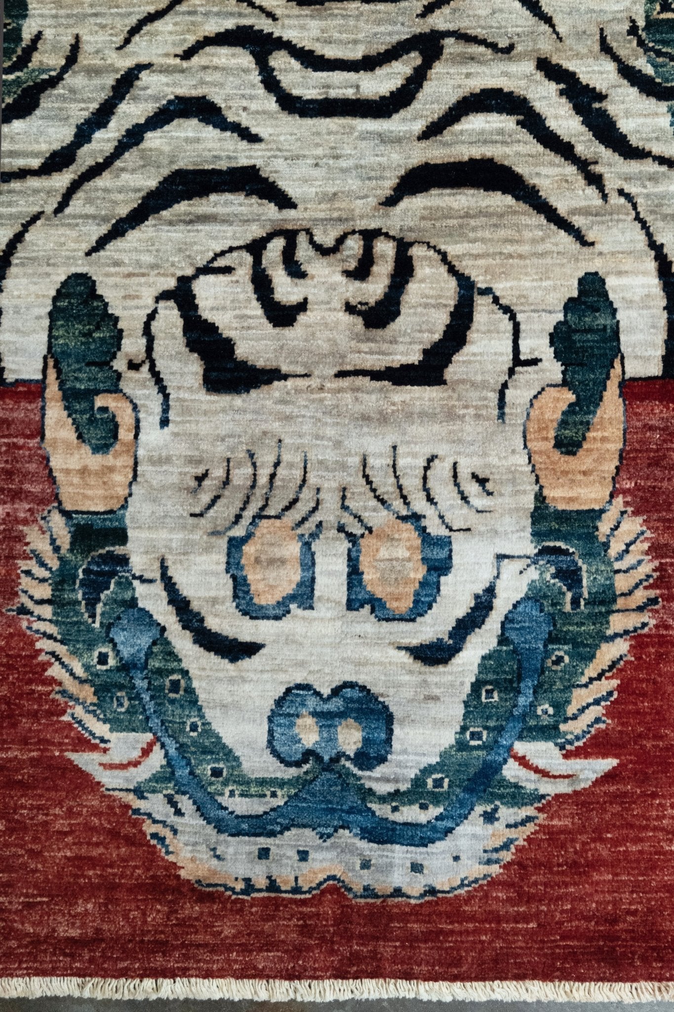 Brand new Tibetan tiger rug with rust red, ivory tiger, teal blue, handmade wool accent rug 3x5 from Indigo Rugs Burlingame Bay Area.