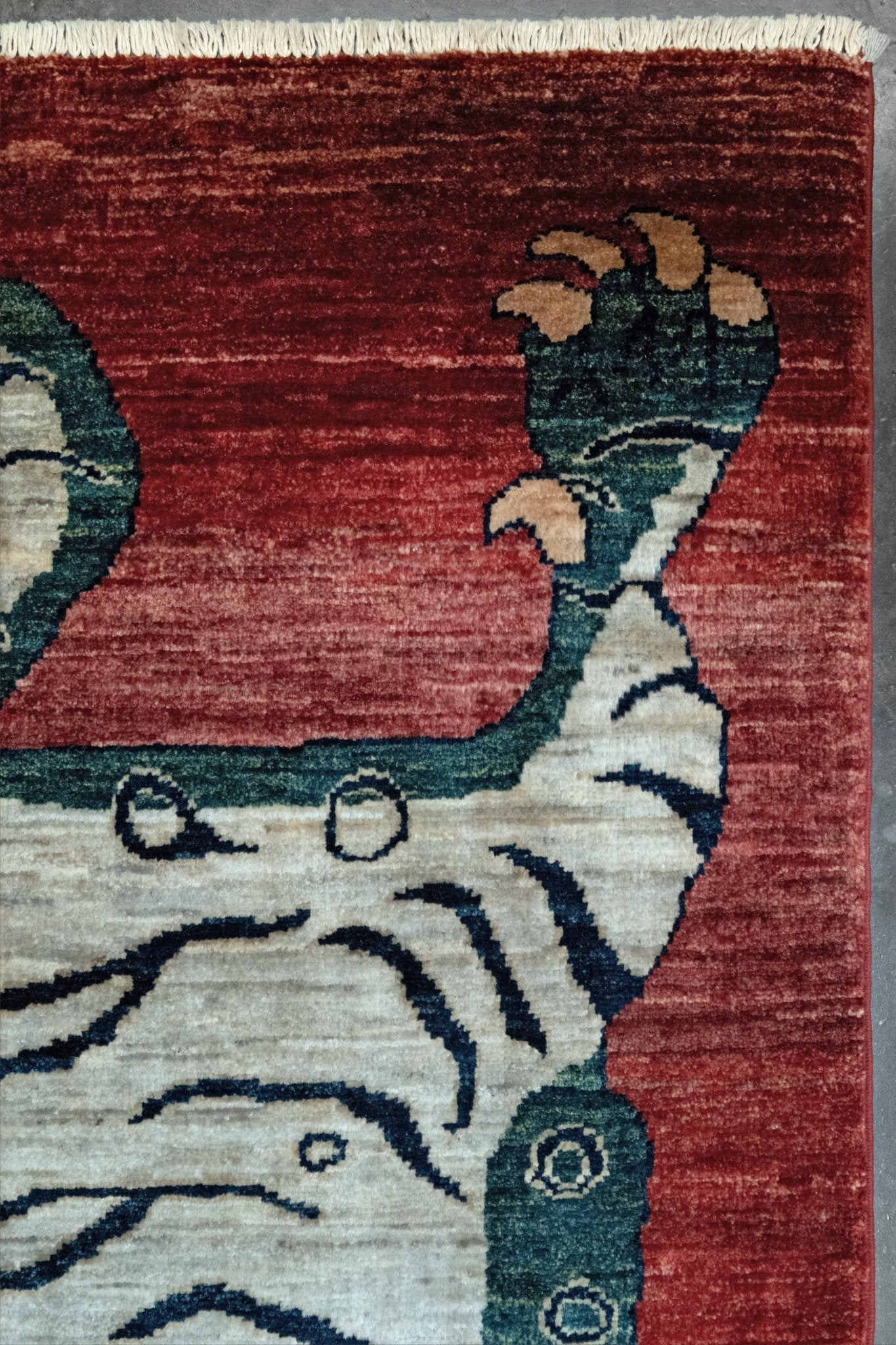 Brand new Tibetan tiger rug with rust red, ivory tiger, teal blue, handmade wool accent rug 3x5 from Indigo Rugs Burlingame Bay Area.