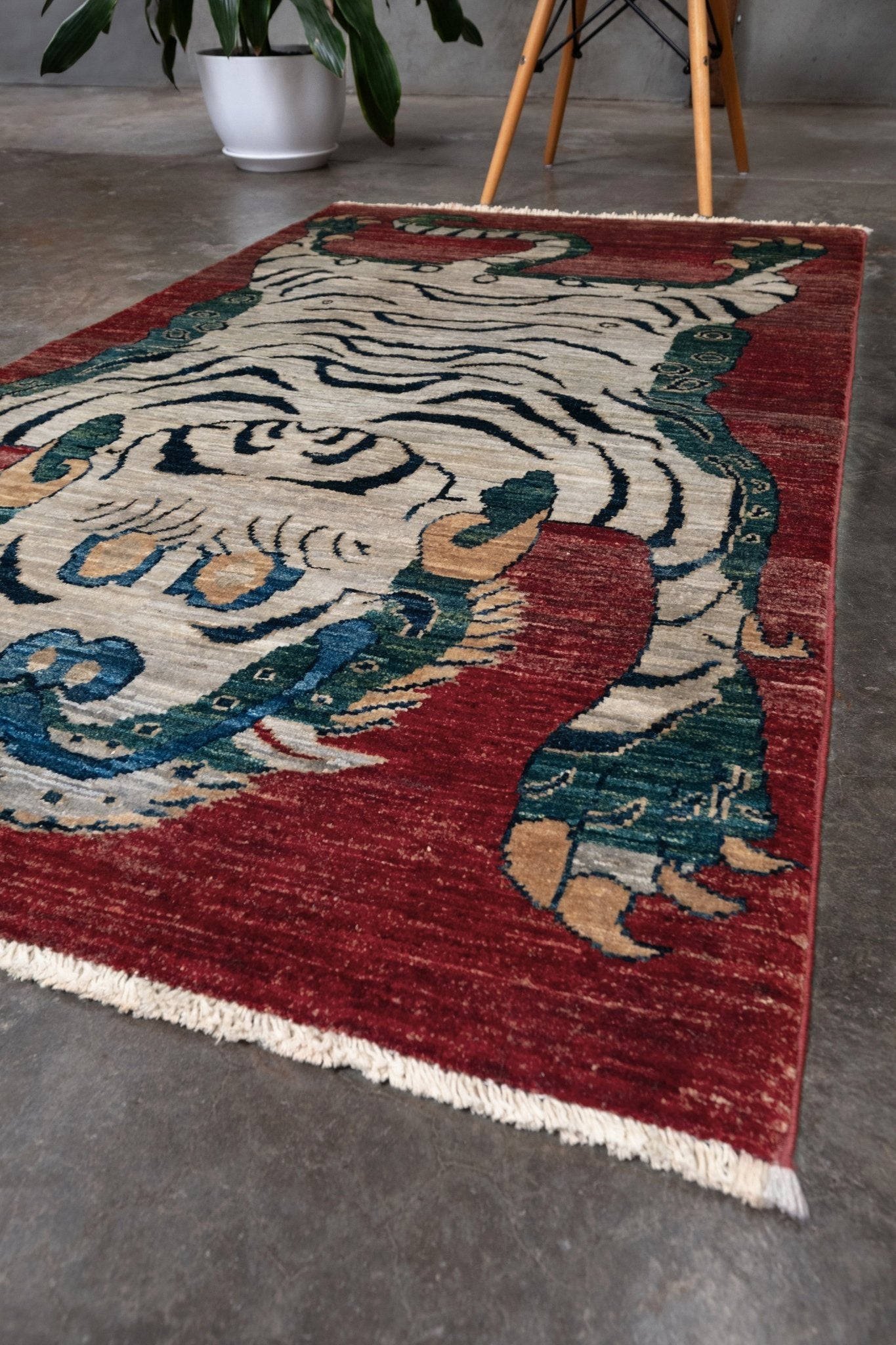 Brand new Tibetan tiger rug with rust red, ivory tiger, teal blue, handmade wool accent rug 3x5 from Indigo Rugs Burlingame Bay Area.