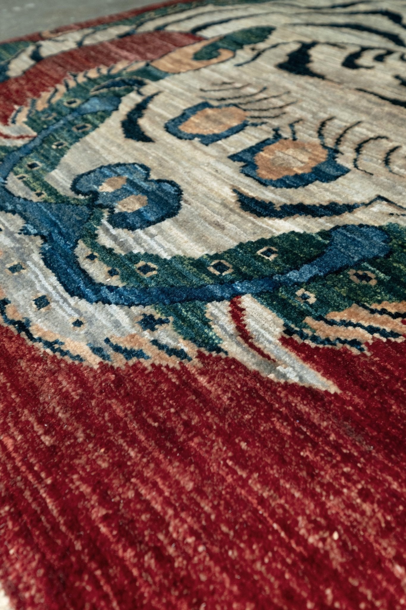 Brand new Tibetan tiger rug with rust red, ivory tiger, teal blue, handmade wool accent rug 3x5 from Indigo Rugs Burlingame Bay Area.