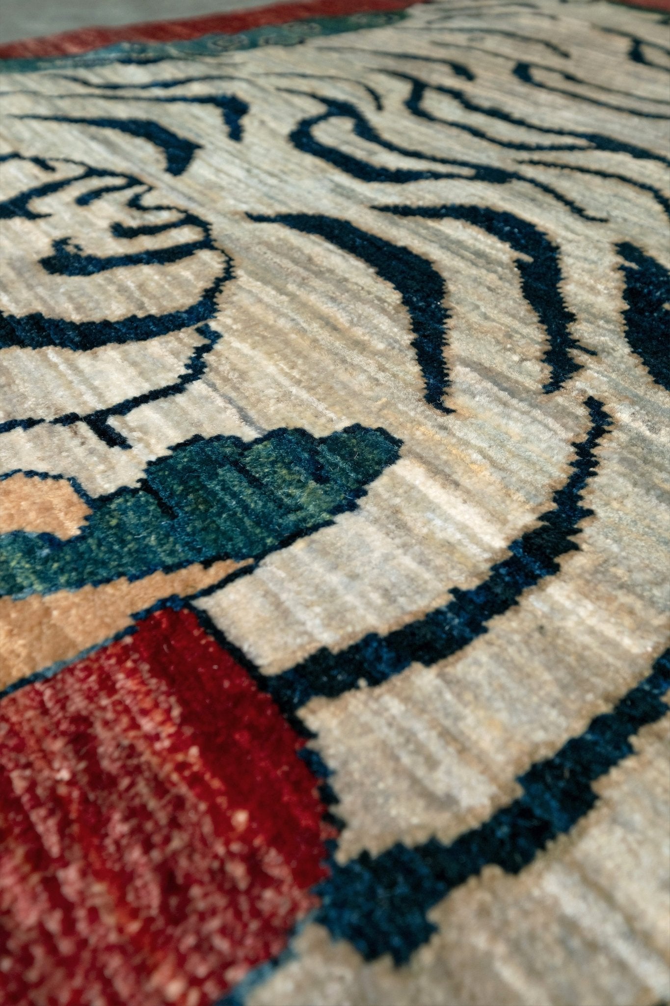 Brand new Tibetan tiger rug with rust red, ivory tiger, teal blue, handmade wool accent rug 3x5 from Indigo Rugs Burlingame Bay Area.
