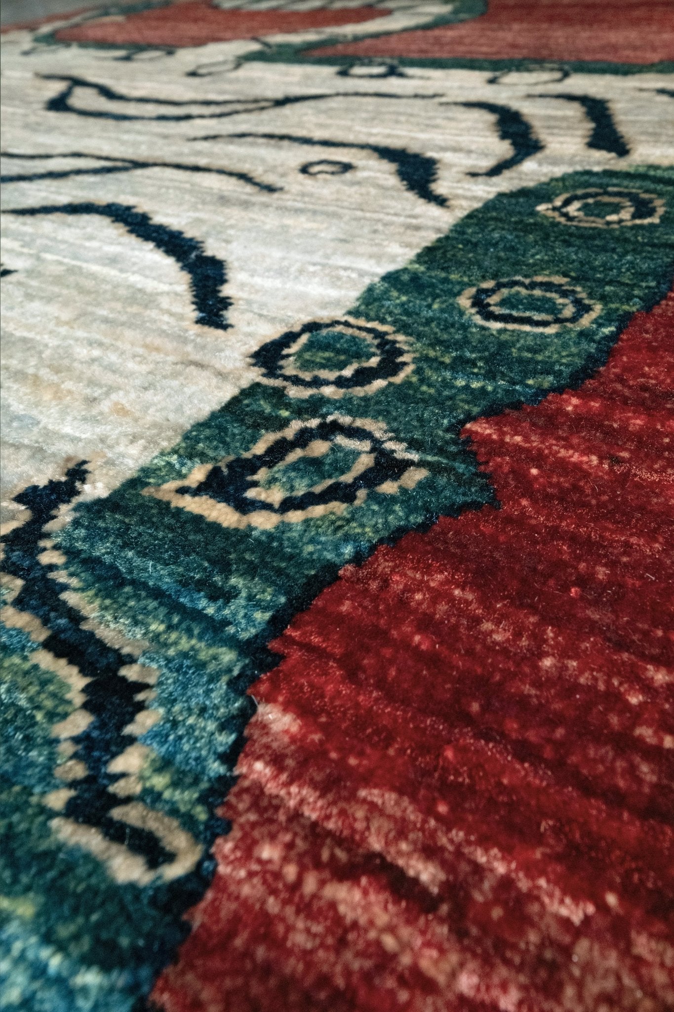 Close-up of Brand new Tibetan tiger rug with rust red, ivory tiger, teal blue, handmade wool accent rug 3x5 from Indigo Rugs Burlingame Bay Area.