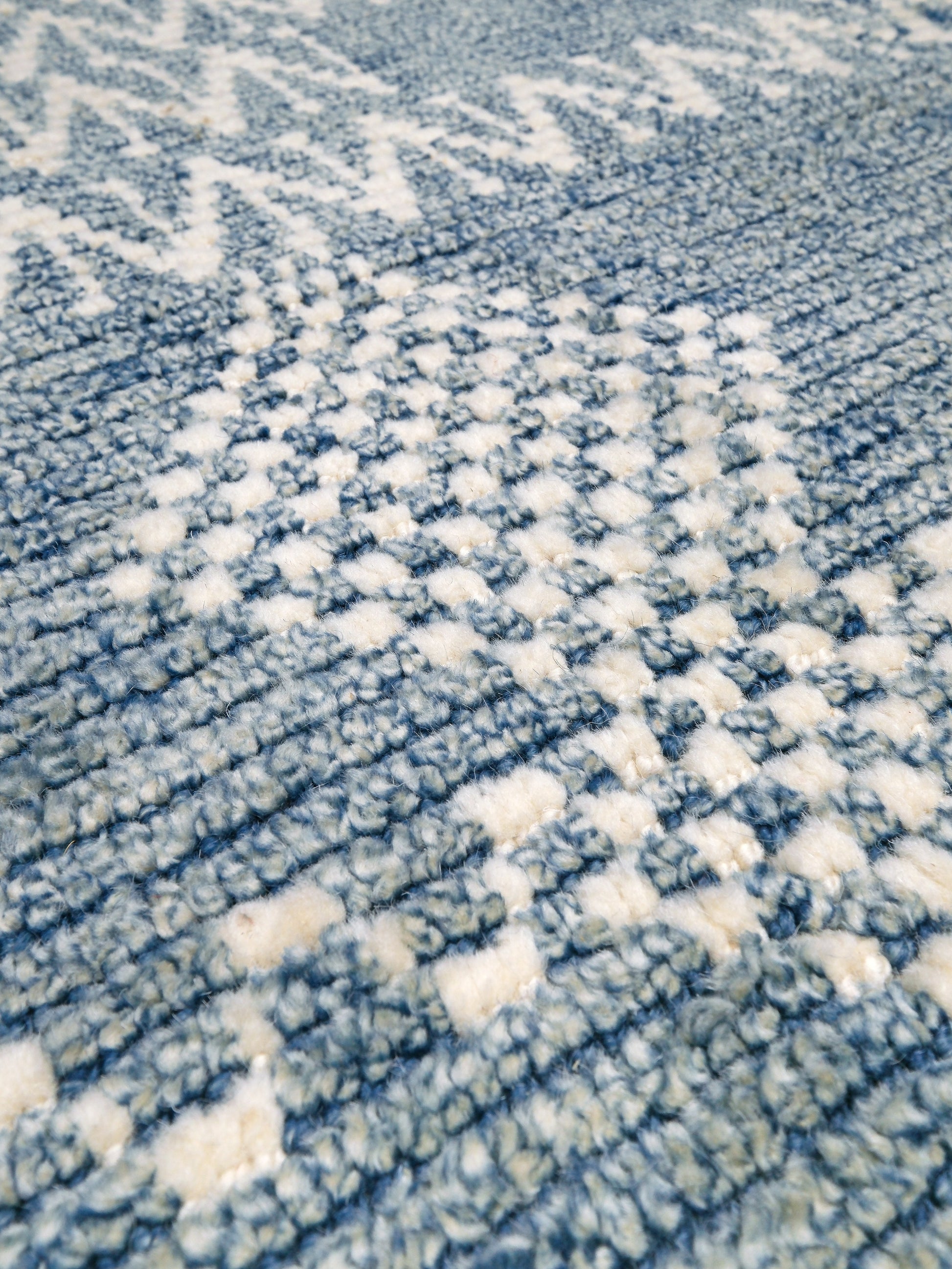 Small blue Turkish Tulu rug with ivory geometric motifs, checker details and textured wool pile, handmade wool rug 4x6 from Indigo Rugs Burlingame Bay Area.