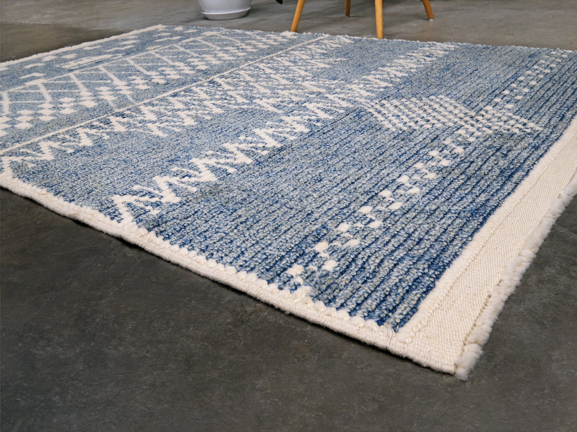 Small blue Turkish Tulu rug with ivory geometric motifs, checker details and textured wool pile, handmade wool rug 4x6 from Indigo Rugs Burlingame Bay Area.