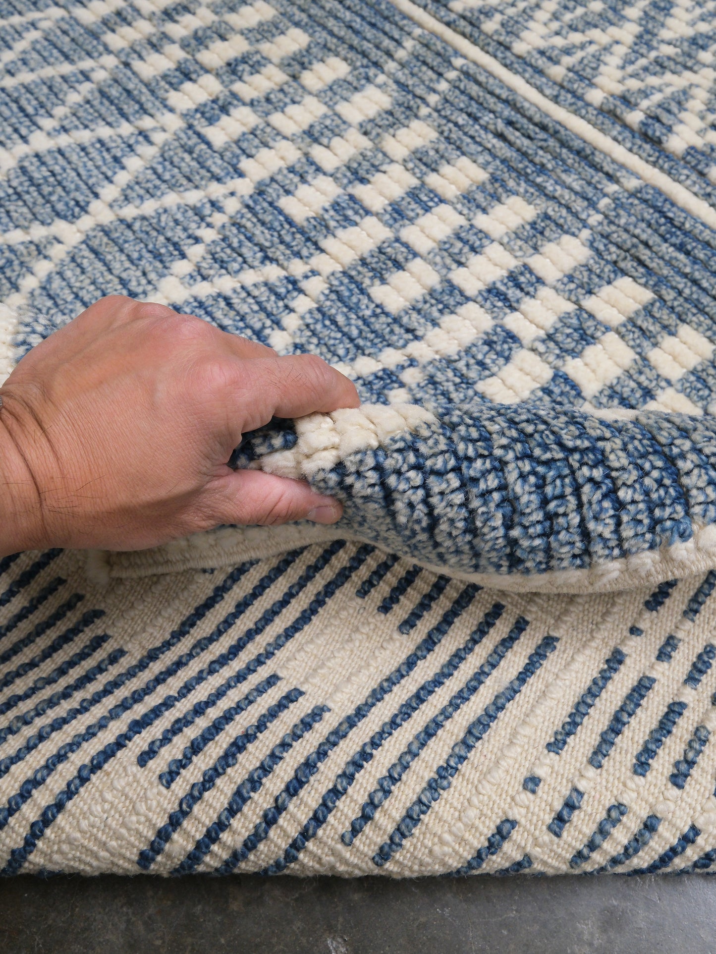 Small blue Turkish Tulu rug with ivory geometric motifs, checker details and textured wool pile, handmade wool rug 4x6 from Indigo Rugs Burlingame Bay Area.