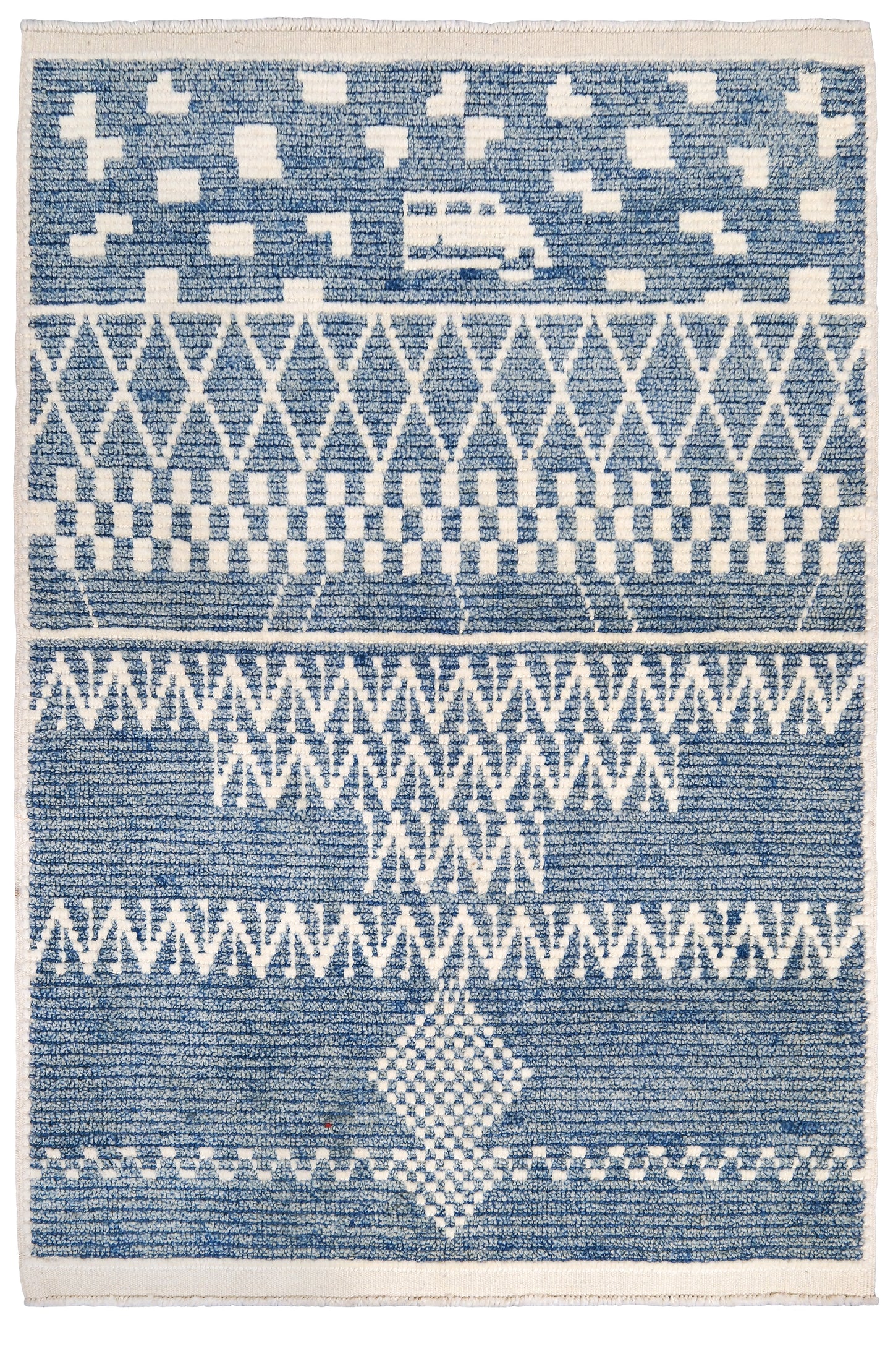 Blue and white patterned rug with geometric design. Small blue Turkish Tulu rug with ivory geometric motifs, checker details and textured wool pile, handmade wool rug 4x6 from Indigo Rugs Burlingame Bay Area.
