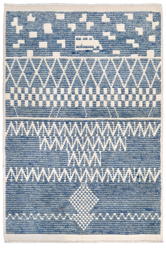 Blue and white patterned rug with geometric design. Small blue Turkish Tulu rug with ivory geometric motifs, checker details and textured wool pile, handmade wool rug 4x6 from Indigo Rugs Burlingame Bay Area.