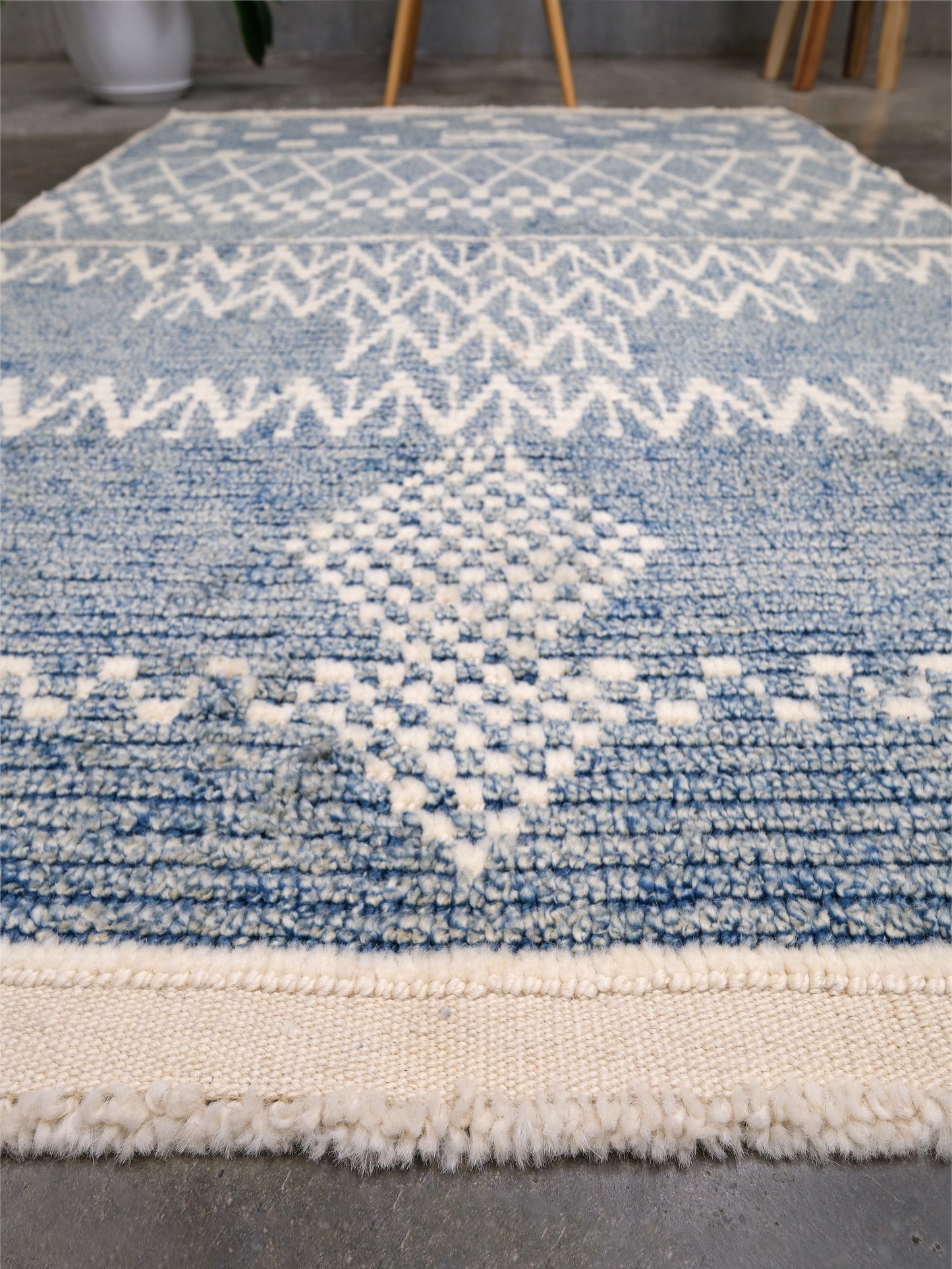 Small blue Turkish Tulu rug with ivory geometric motifs, checker details and textured wool pile, handmade wool rug 4x6 from Indigo Rugs Burlingame Bay Area.