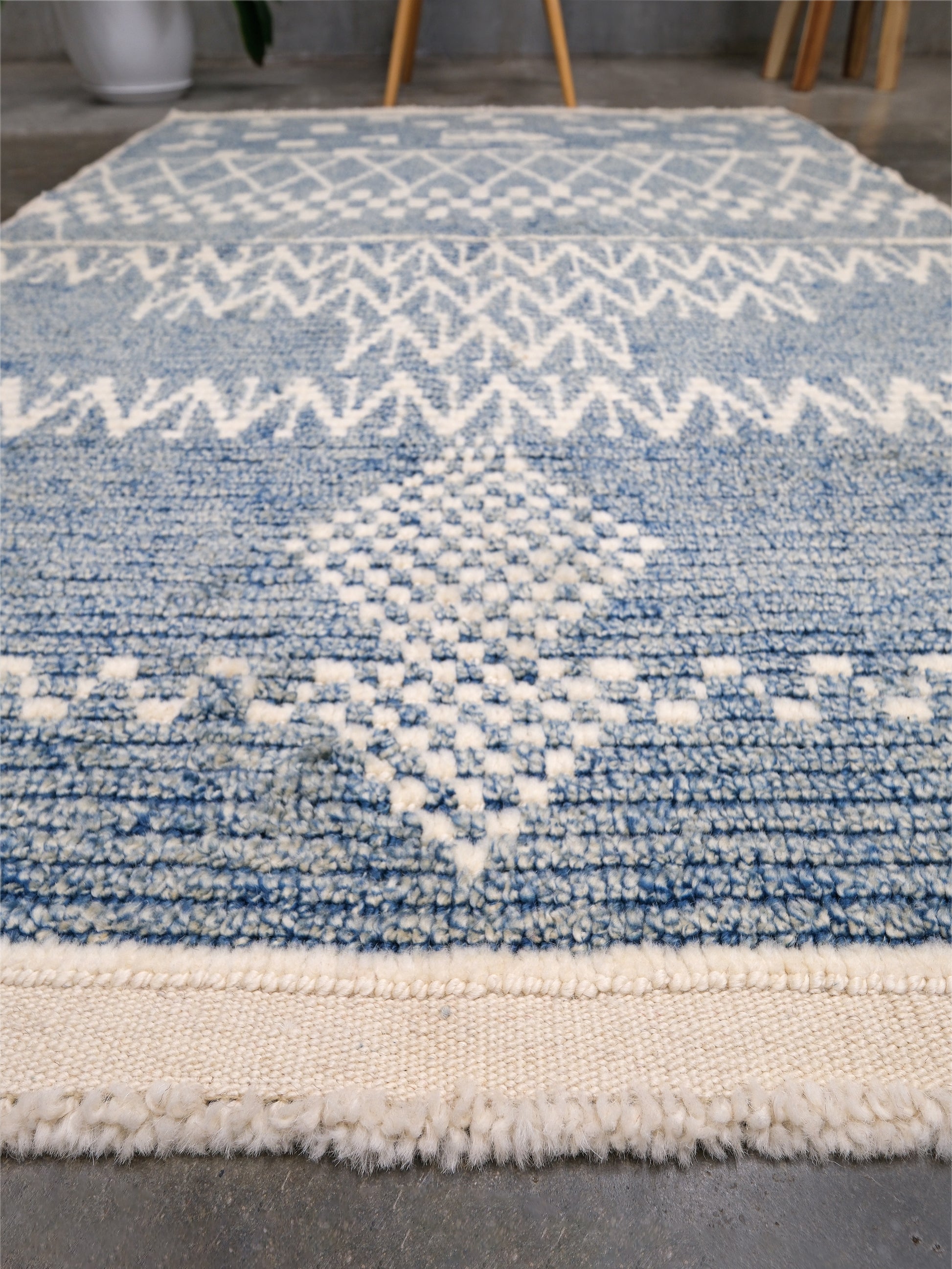 Small blue Turkish Tulu rug with ivory geometric motifs, checker details and textured wool pile, handmade wool rug 4x6 from Indigo Rugs Burlingame Bay Area.
