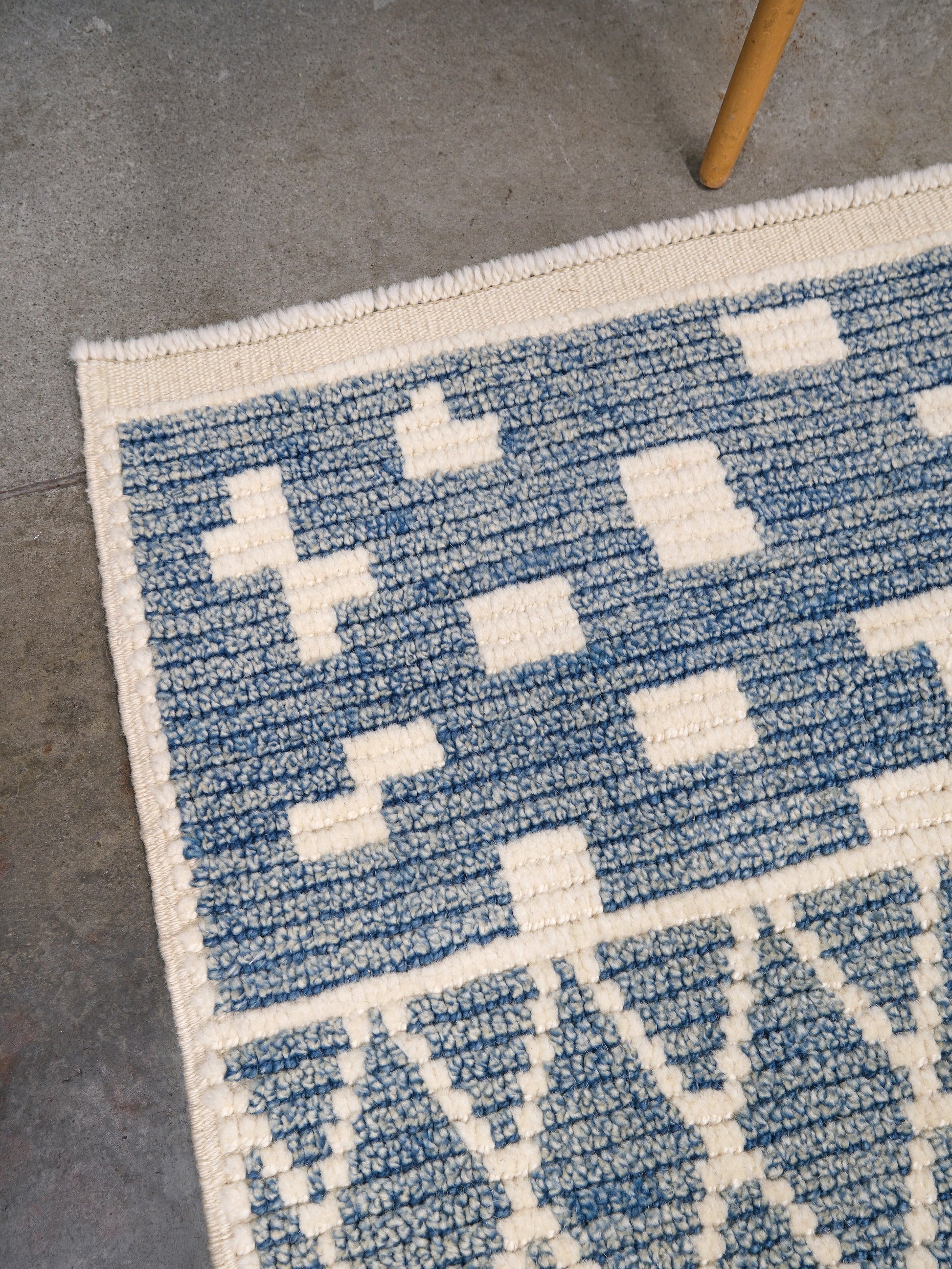 Small blue Turkish Tulu rug with ivory geometric motifs, checker details and textured wool pile, handmade wool rug 4x6 from Indigo Rugs Burlingame Bay Area.