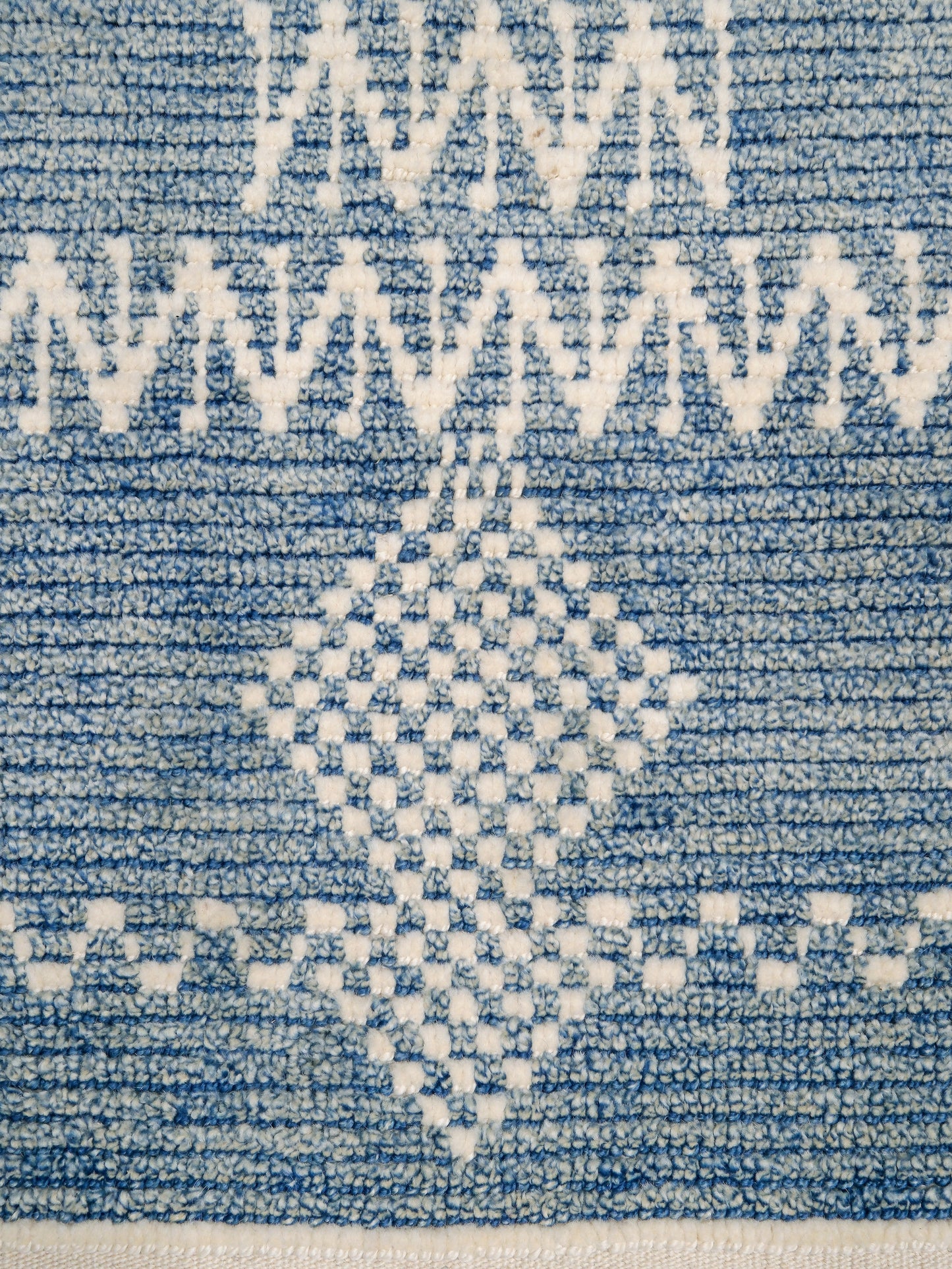 Small blue Turkish Tulu rug with ivory geometric motifs, checker details and textured wool pile, handmade wool rug 4x6 from Indigo Rugs Burlingame Bay Area.