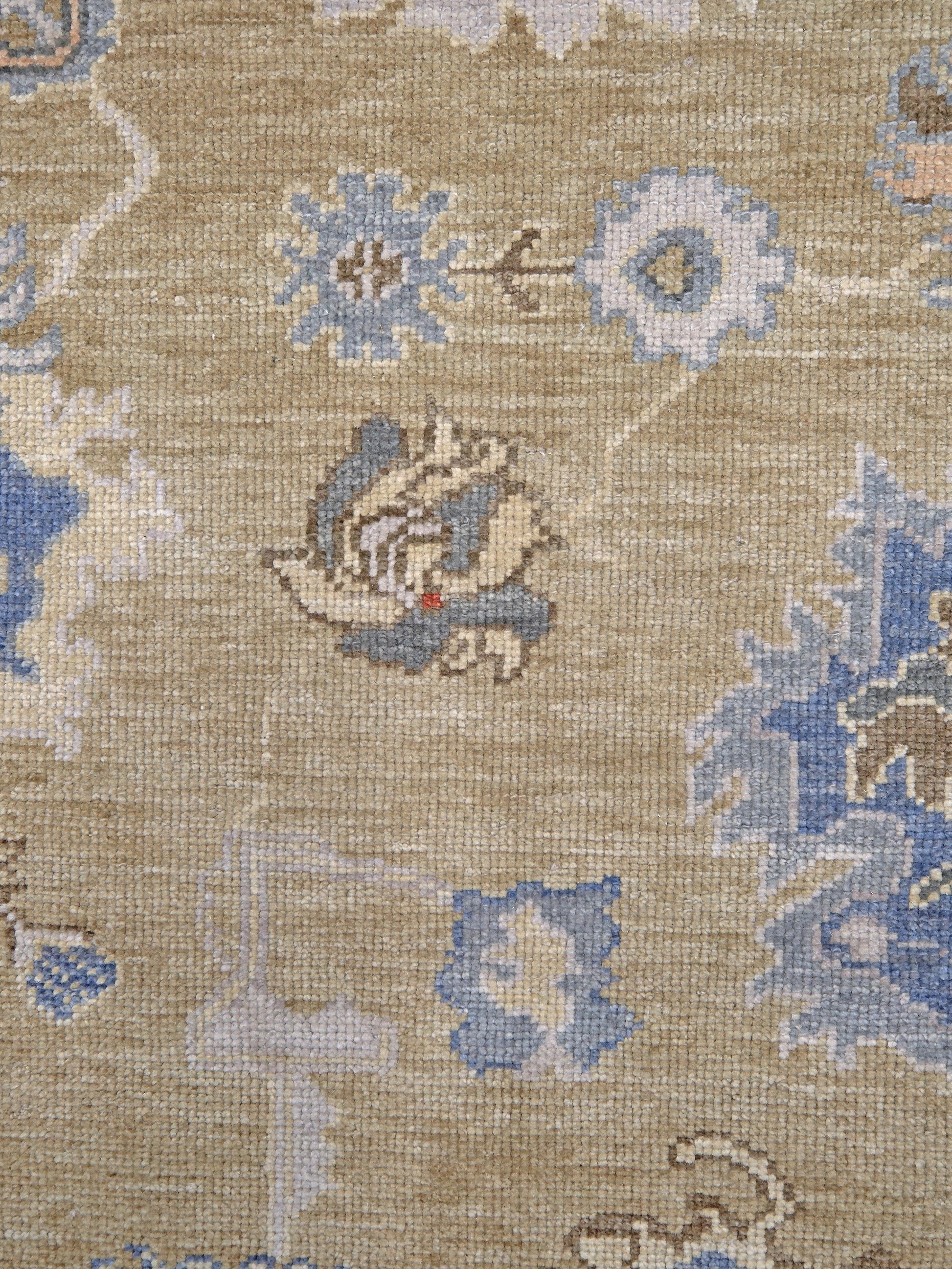 Light olive Turkish Oushak rug with warm ivory border, powder blue floral motifs, soft gray, taupe, and rust accents, hand-knotted wool 10x14 area rug from Indigo Rugs Burlingame Bay Area.