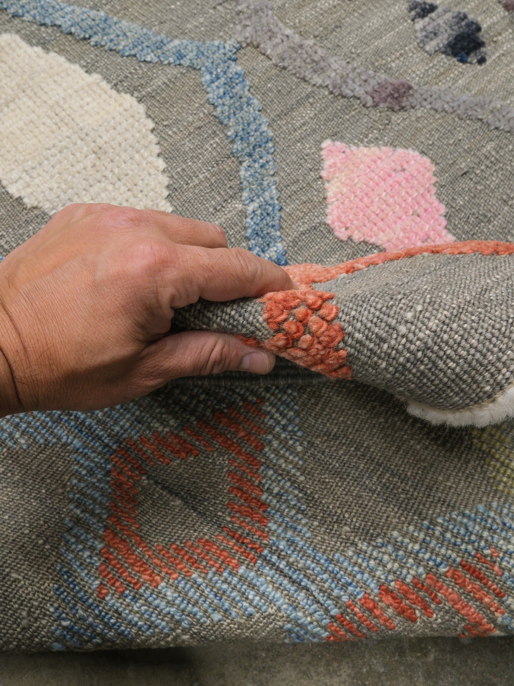Warm gray vibrant modern Turkish Tulu rug with colorful raised diamond motifs, 3D wool pile texture, handmade wool area rug 9x12 from Indigo Rugs Burlingame Bay Area.