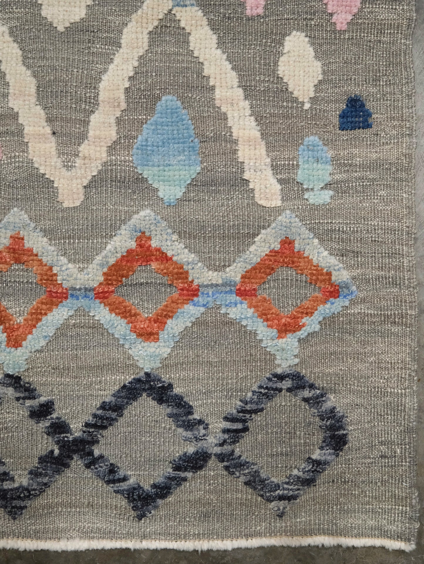 Warm gray vibrant modern Turkish Tulu rug with colorful raised diamond motifs, 3D wool pile texture, handmade wool area rug 9x12 from Indigo Rugs Burlingame Bay Area.