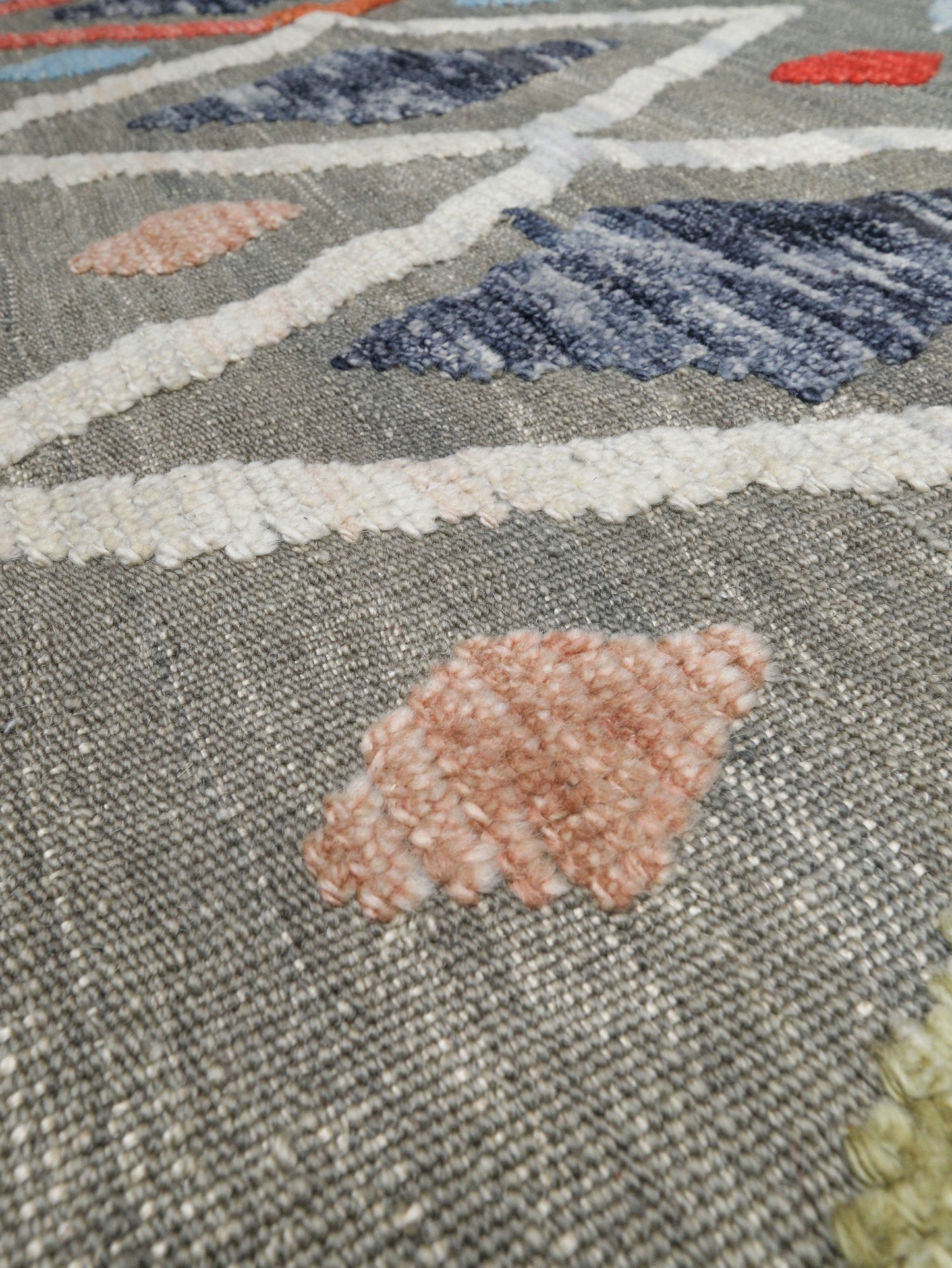 Warm gray vibrant modern Turkish Tulu rug with colorful raised diamond motifs, 3D wool pile texture, handmade wool area rug 9x12 from Indigo Rugs Burlingame Bay Area.