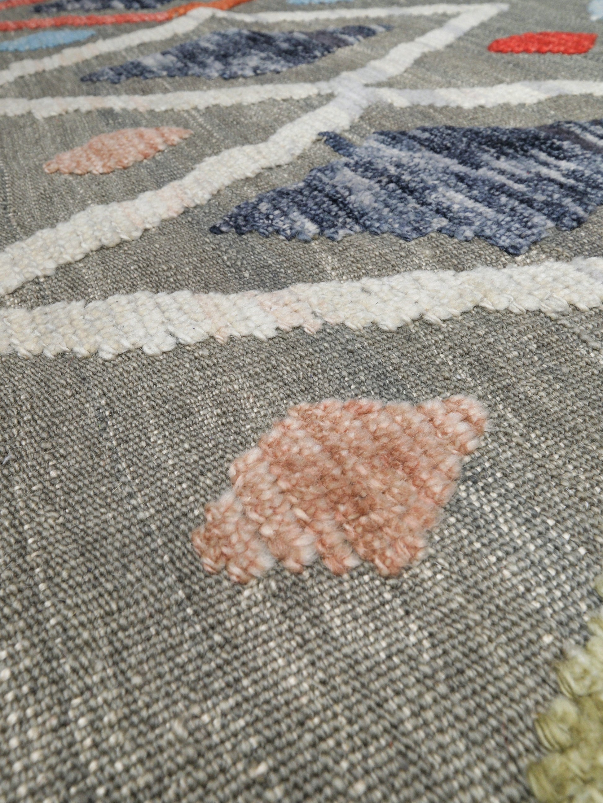 Warm gray vibrant modern Turkish Tulu rug with colorful raised diamond motifs, 3D wool pile texture, handmade wool area rug 9x12 from Indigo Rugs Burlingame Bay Area.