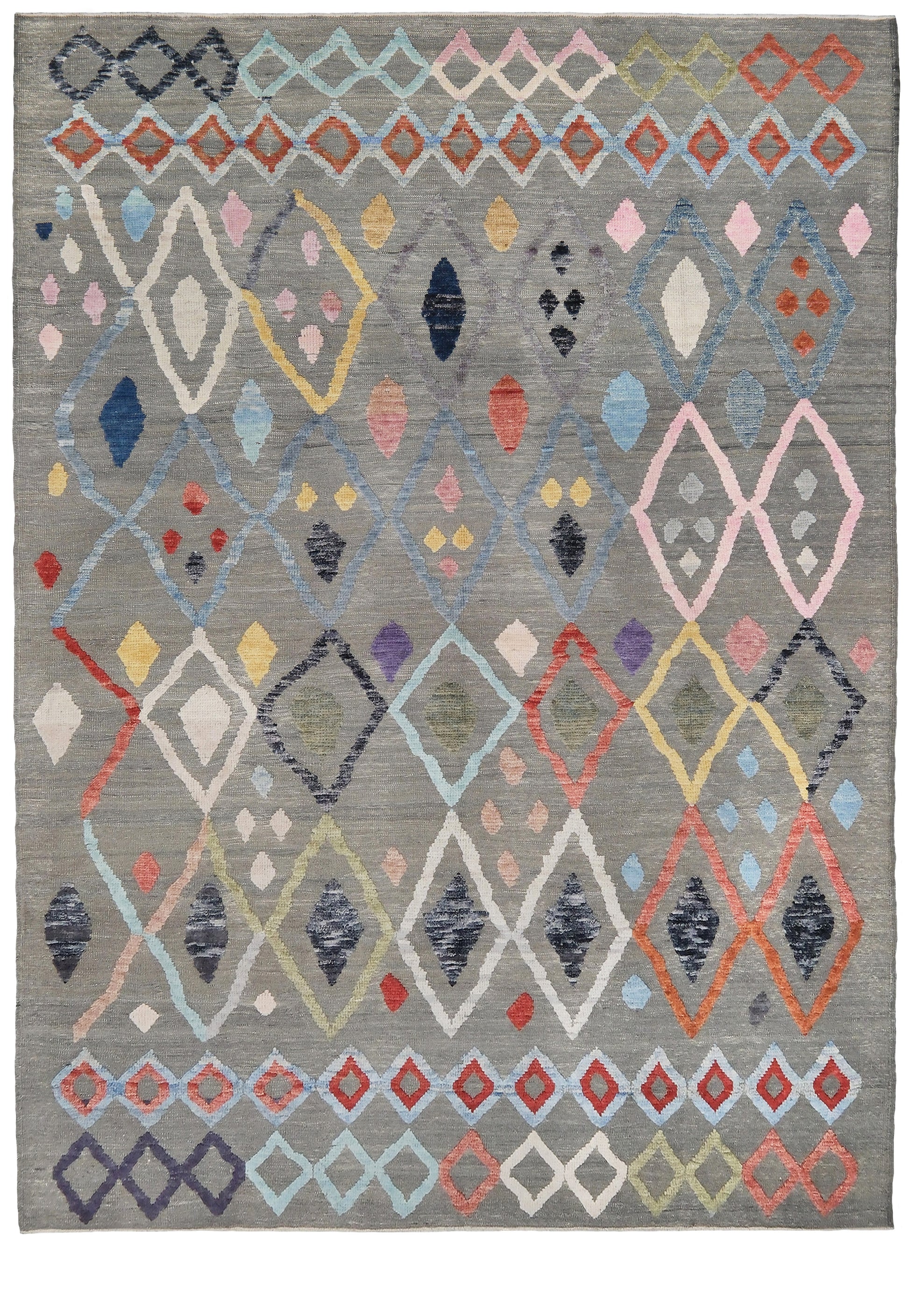 Multicolored geometric patterned rug on a plain background. Warm gray vibrant modern Turkish Tulu rug with colorful raised diamond motifs, 3D wool pile texture, handmade wool area rug 9x12 from Indigo Rugs Burlingame Bay Area.