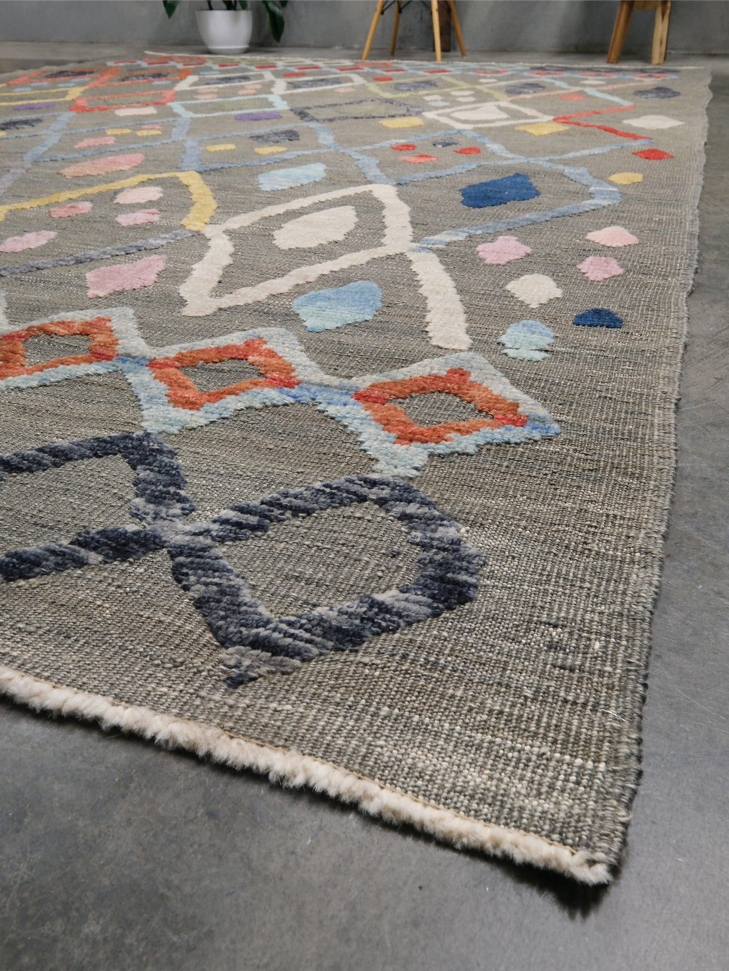 Warm gray vibrant modern Turkish Tulu rug with colorful raised diamond motifs, 3D wool pile texture, handmade wool area rug 9x12 from Indigo Rugs Burlingame Bay Area.