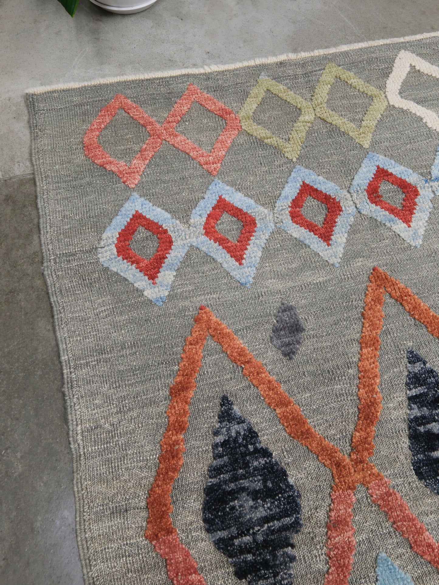 Warm gray vibrant modern Turkish Tulu rug with colorful raised diamond motifs, 3D wool pile texture, handmade wool area rug 9x12 from Indigo Rugs Burlingame Bay Area.