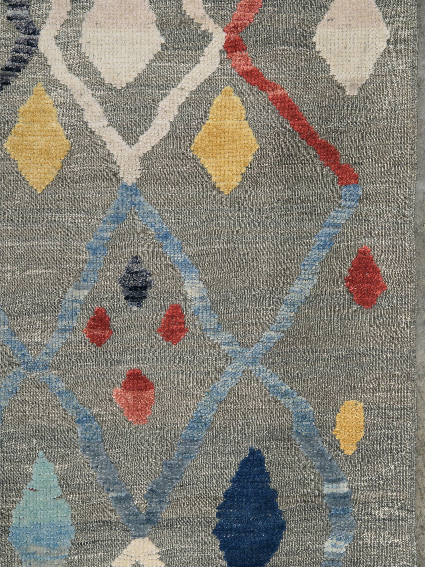 Warm gray vibrant modern Turkish Tulu rug with colorful raised diamond motifs, 3D wool pile texture, handmade wool area rug 9x12 from Indigo Rugs Burlingame Bay Area.