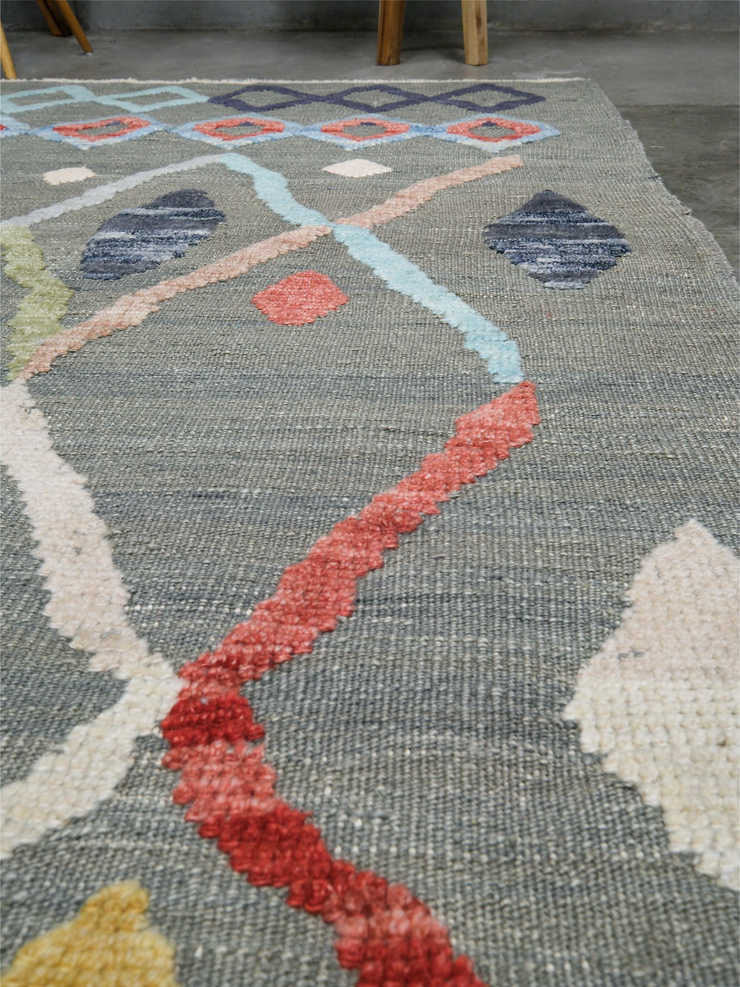 Warm gray vibrant modern Turkish Tulu rug with colorful raised diamond motifs, 3D wool pile texture, handmade wool area rug 9x12 from Indigo Rugs Burlingame Bay Area.