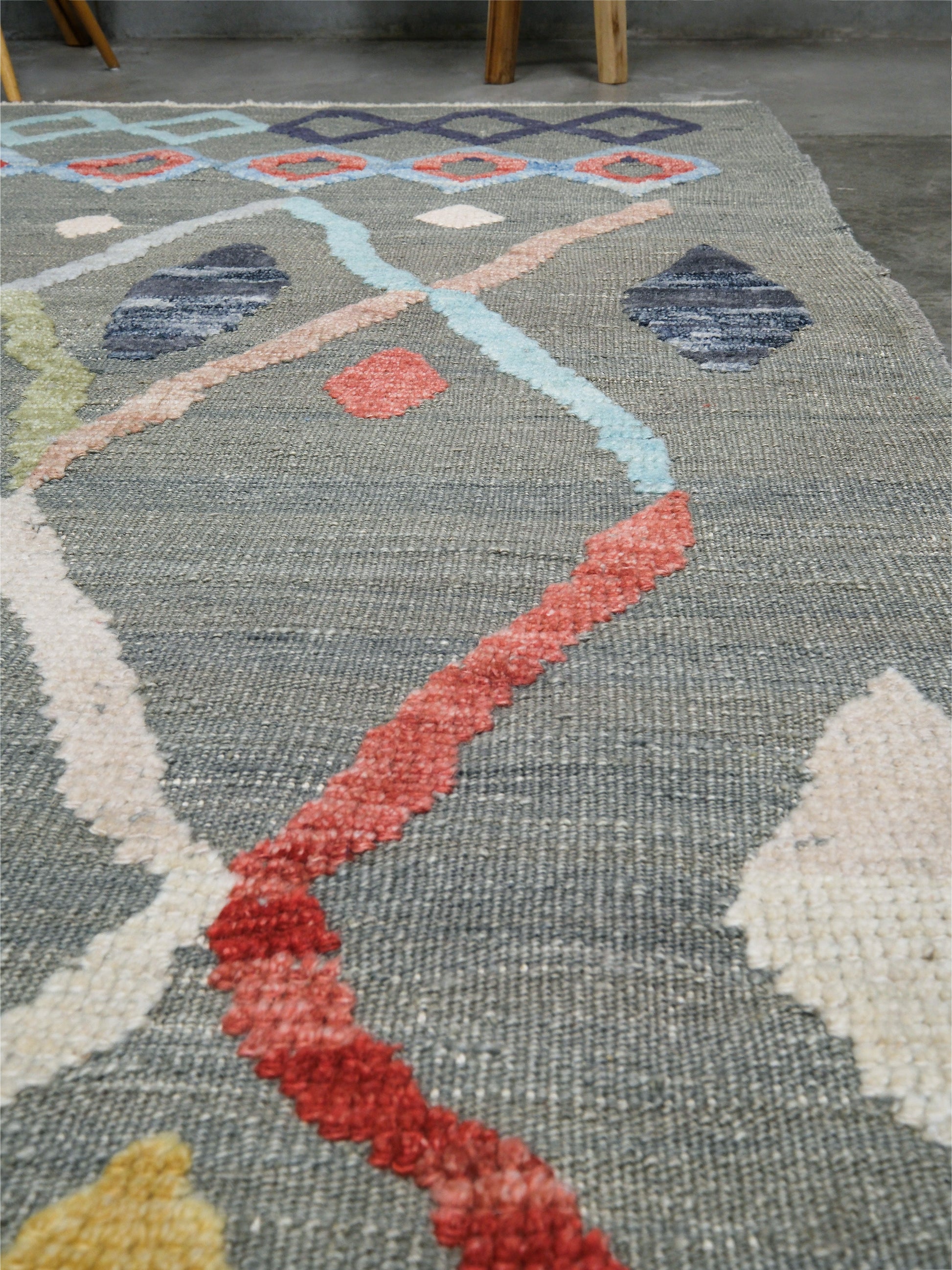 Warm gray vibrant modern Turkish Tulu rug with colorful raised diamond motifs, 3D wool pile texture, handmade wool area rug 9x12 from Indigo Rugs Burlingame Bay Area.