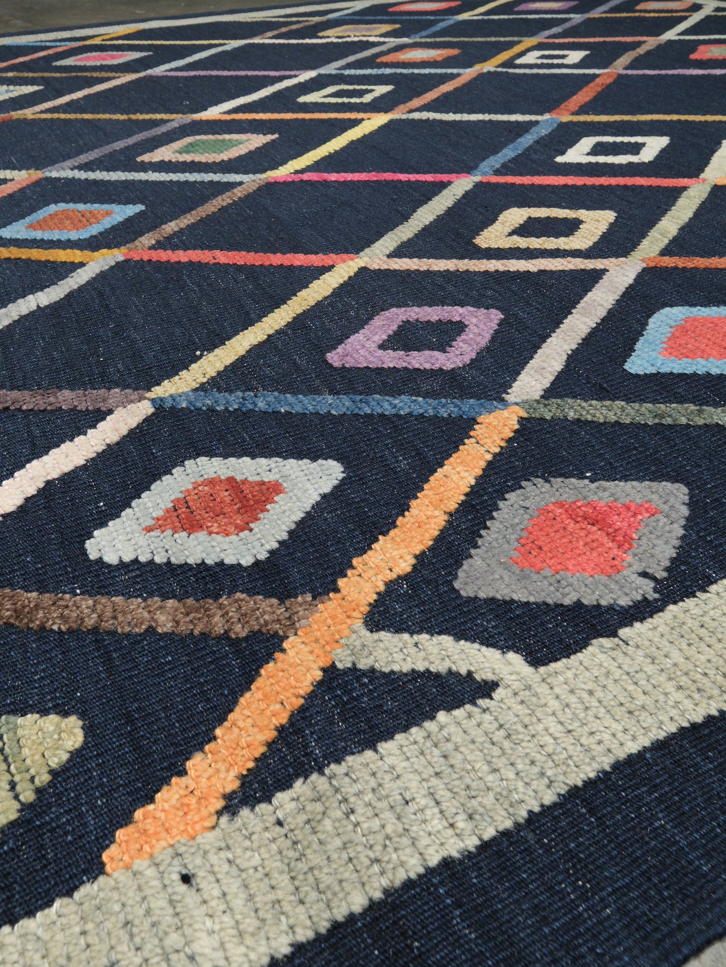 Modern Vibrant Turkish Tulu handmade wool a geometric patterned area rug 9x12 from Indigo Rugs Burlingame Bay Area.