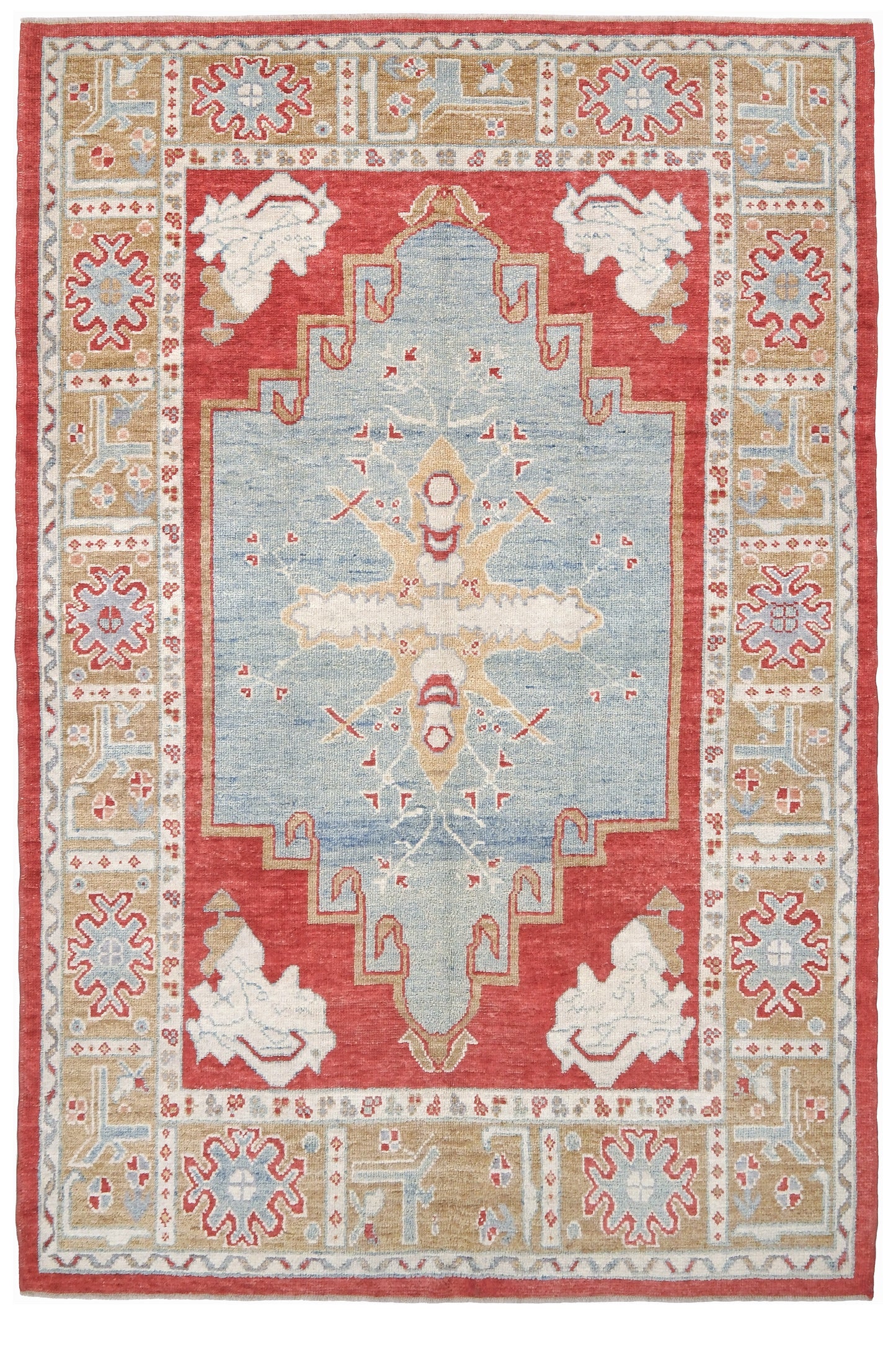A rectangular area rug with a traditional geometric pattern, featuring a central light blue medallion, a red field, and beige and white border motifs. Vibrant soft sky blue and coral 7x10 Turkish Oushak rug with central medallion, golden beige border, floral motifs and warm ivory accents, handmade wool from Indigo Rugs Burlingame Bay Area.