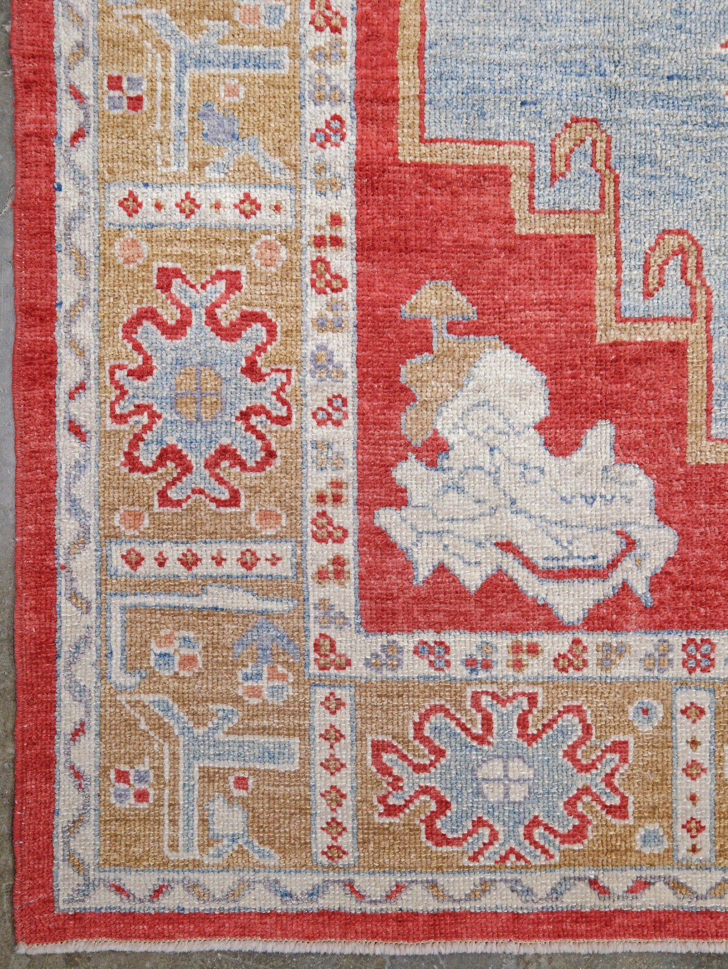 Vibrant soft sky blue and coral red 7x10 Turkish Oushak rug with central medallion, golden beige border, floral motifs and warm ivory accents, handmade wool from Indigo Rugs Burlingame Bay Area.