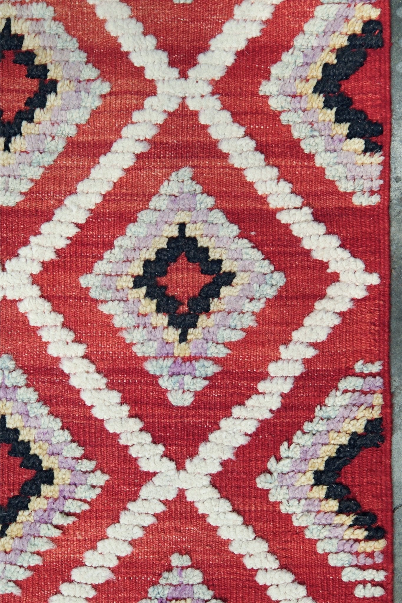 Red Turkish Tulu rug with ivory diamond lattice, raised wool texture, lavender, gray-blue, accents, 6x9 handmade moroccan style area rug from Indigo Rugs Burlingame Bay Area.