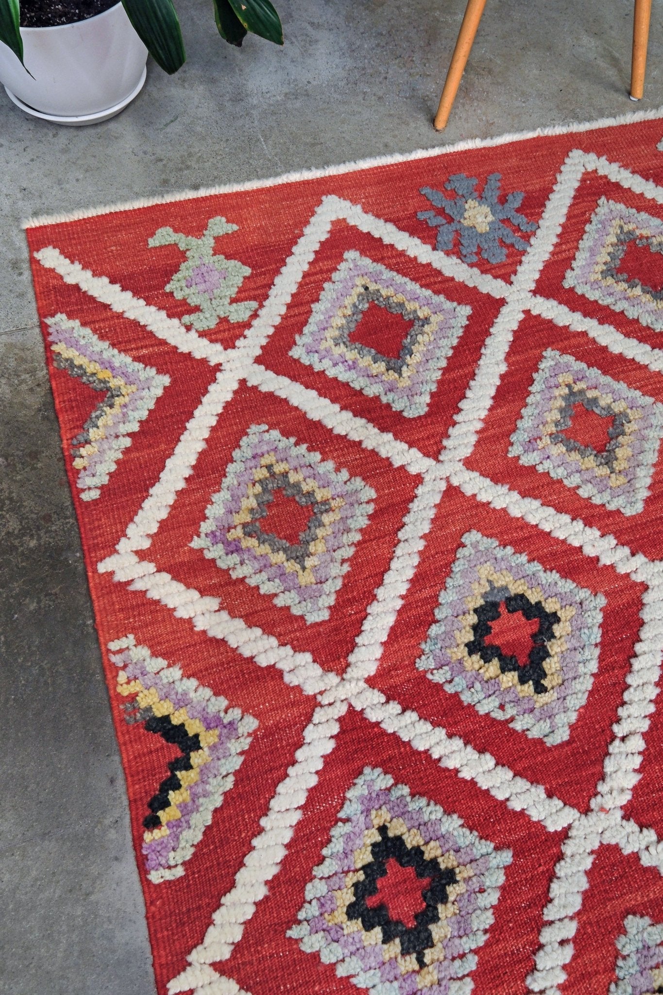 Red Turkish Tulu rug with ivory diamond lattice, raised wool texture, lavender, gray-blue, accents, 6x9 handmade moroccan style area rug from Indigo Rugs Burlingame Bay Area.