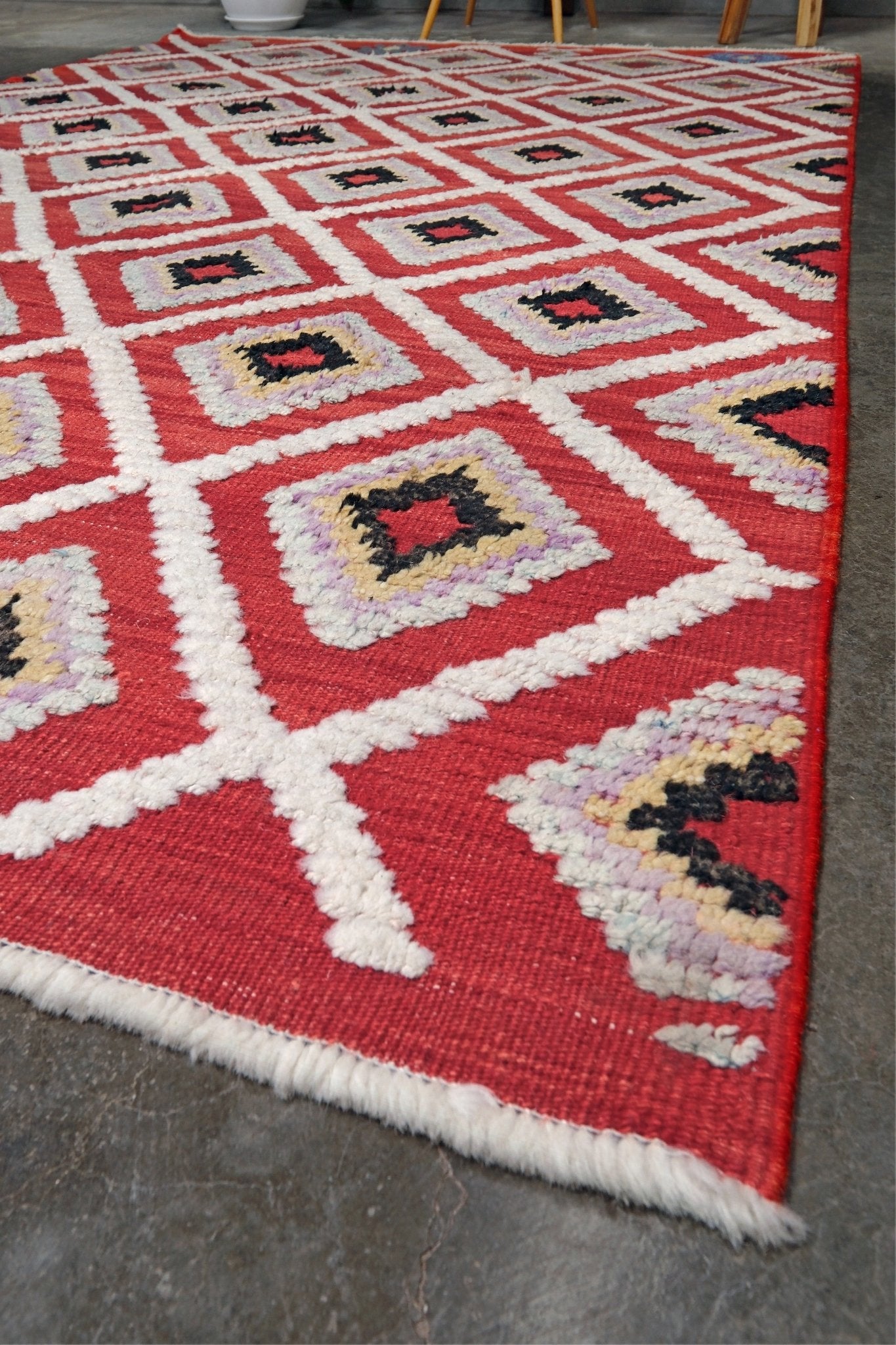 Red Turkish Tulu rug with ivory diamond lattice, raised wool texture, lavender, gray-blue, accents, 6x9 handmade moroccan style area rug from Indigo Rugs Burlingame Bay Area.