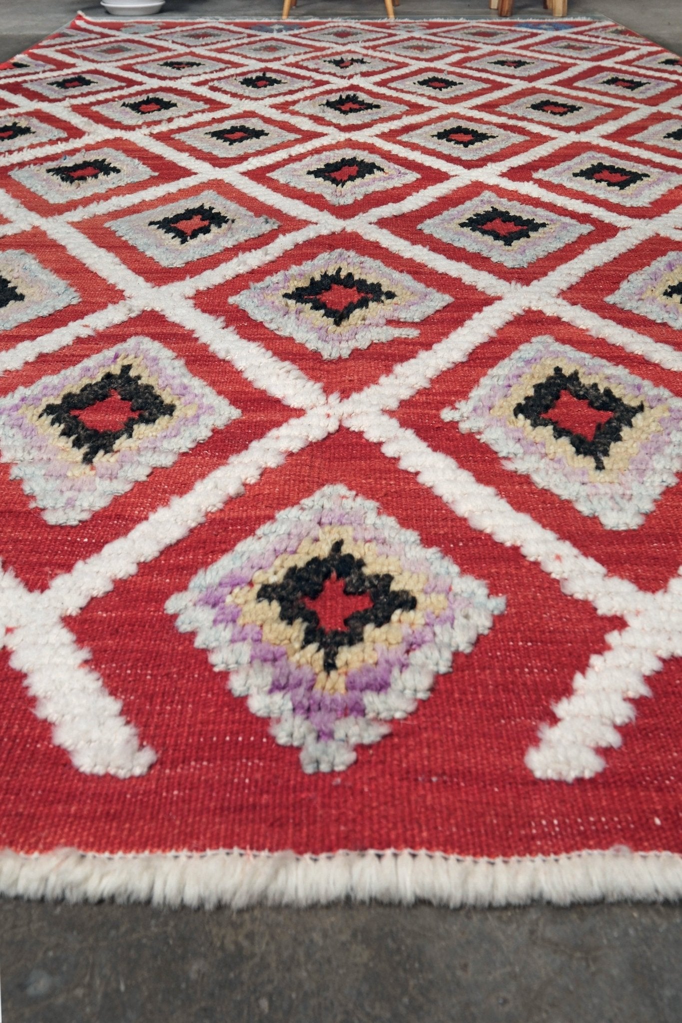 Red Turkish Tulu rug with ivory diamond lattice, raised wool texture, lavender, gray-blue, accents, 6x9 handmade moroccan style area rug from Indigo Rugs Burlingame Bay Area.