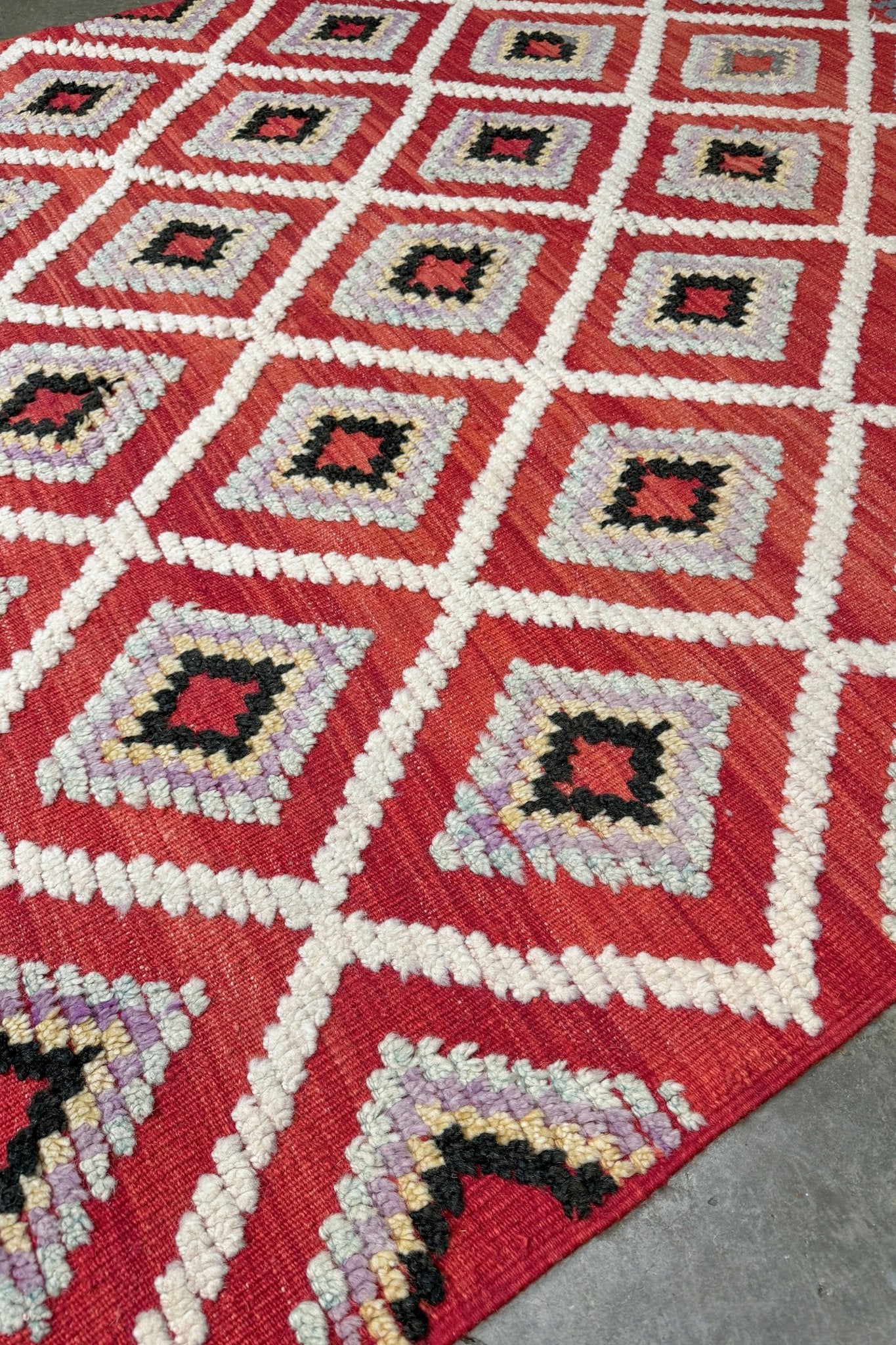 Red Turkish Tulu rug with ivory diamond lattice, raised wool texture, lavender, gray-blue, accents, 6x9 handmade moroccan style area rug from Indigo Rugs Burlingame Bay Area.