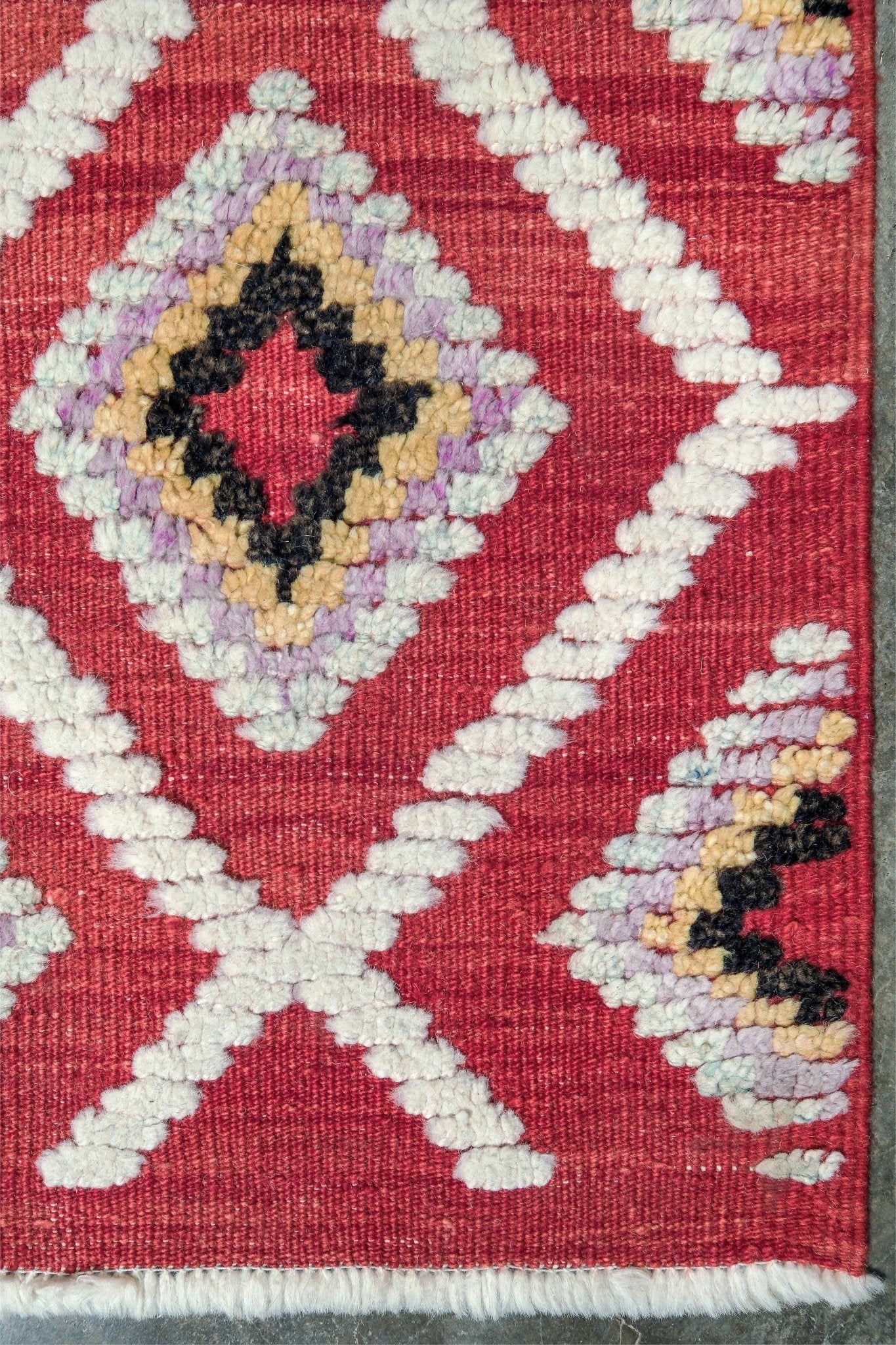 Red Turkish Tulu rug with ivory diamond lattice, raised wool texture, lavender, gray-blue, accents, 6x9 handmade moroccan style area rug from Indigo Rugs Burlingame Bay Area.