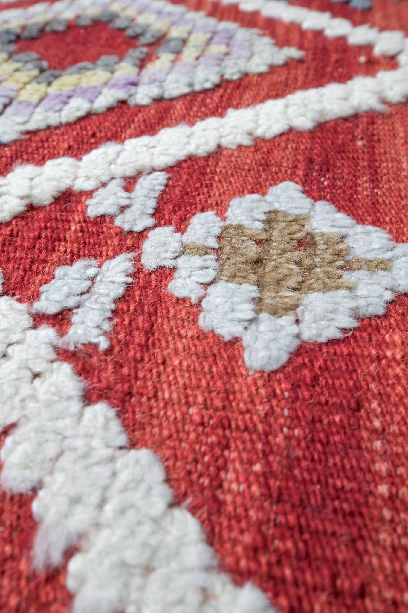 Red Turkish Tulu rug with ivory diamond lattice, raised wool texture, lavender, gray-blue, accents, 6x9 handmade moroccan style area rug from Indigo Rugs Burlingame Bay Area.
