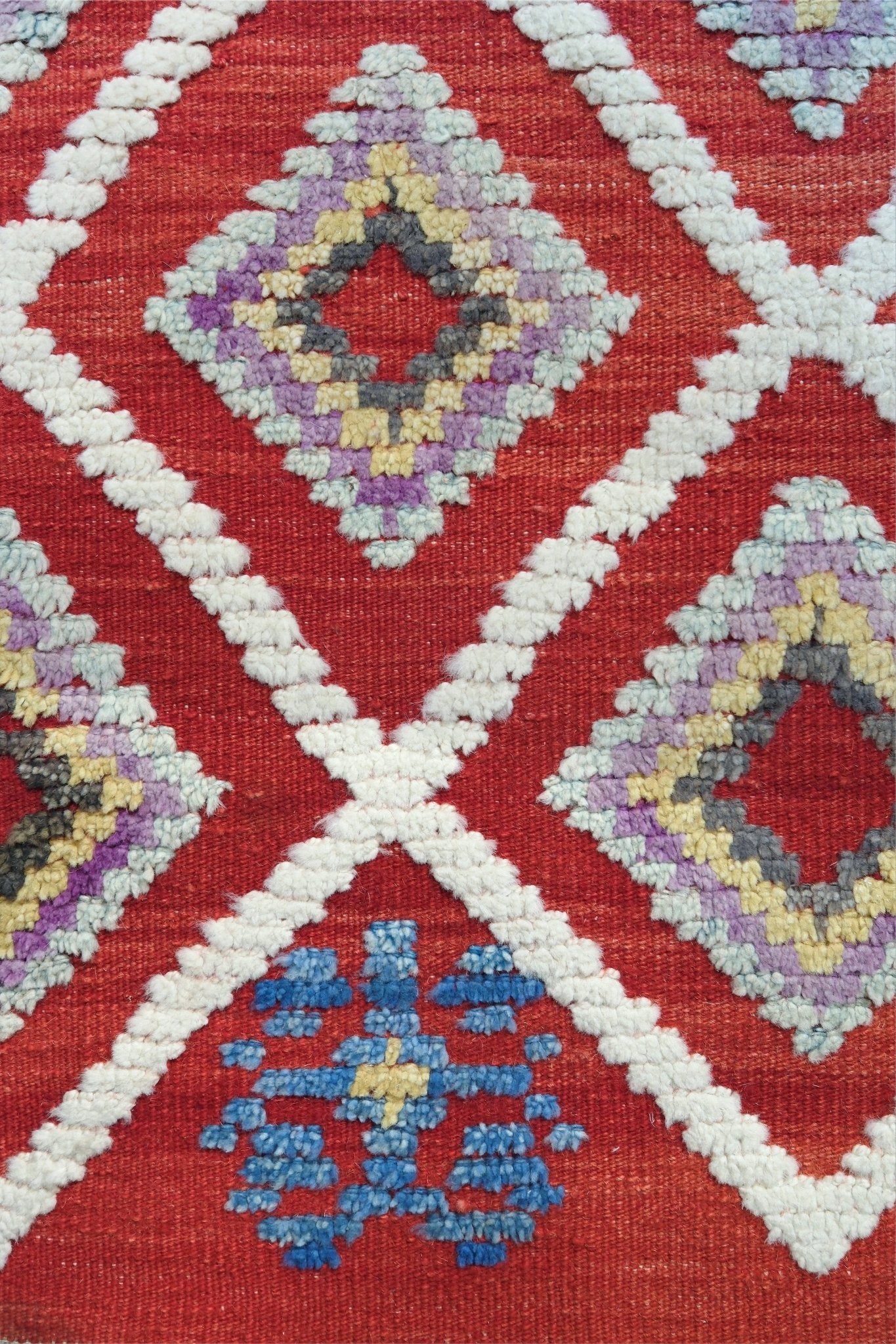 Red Turkish Tulu rug with ivory diamond lattice, raised wool texture, lavender, gray-blue, accents, 6x9 handmade moroccan style area rug from Indigo Rugs Burlingame Bay Area.