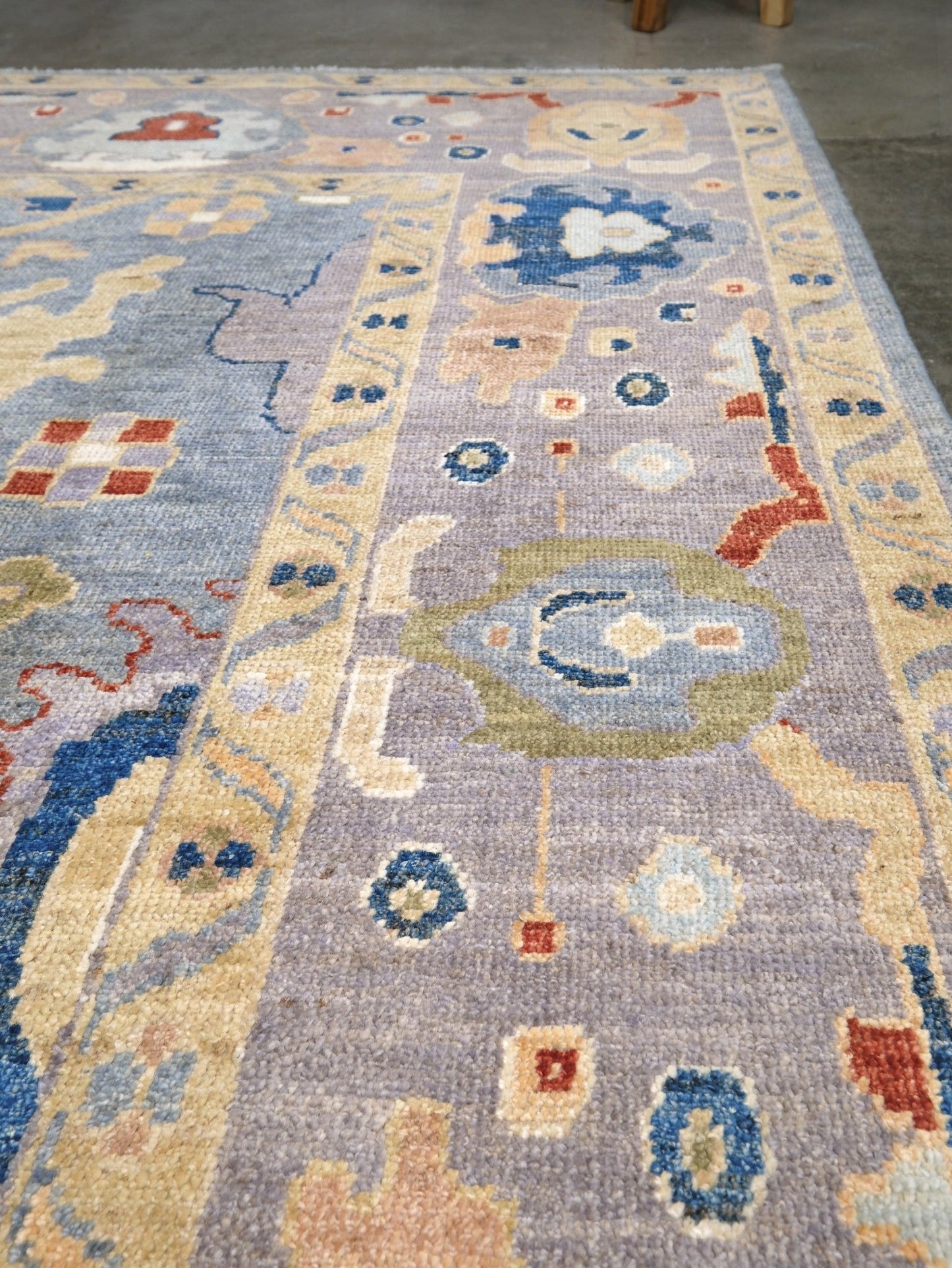 Powder blue Turkish Oushak rug with pale lavender border, warm ivory floral motifs, hand-knotted wool area rug 8x10 from Indigo Rugs Burlingame Bay Area.