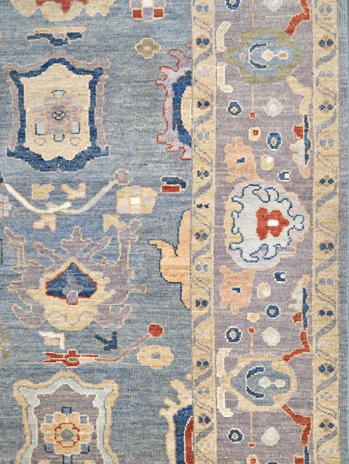 Powder blue Turkish Oushak rug with pale lavender border, warm ivory floral motifs, hand-knotted wool area rug 8x10 from Indigo Rugs Burlingame Bay Area.
