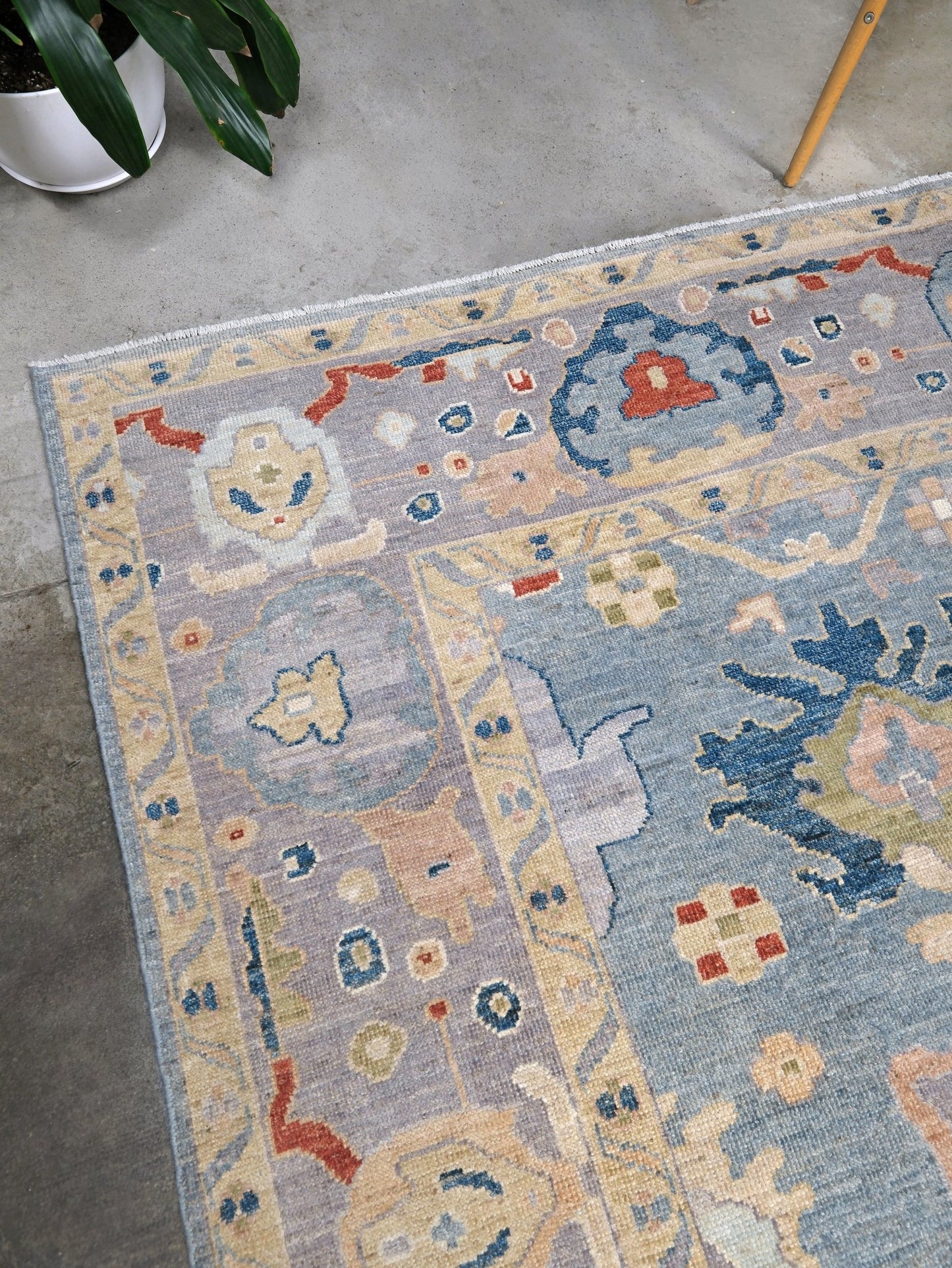 Powder blue Turkish Oushak rug with pale lavender border, warm ivory floral motifs, hand-knotted wool area rug 8x10 from Indigo Rugs Burlingame Bay Area.