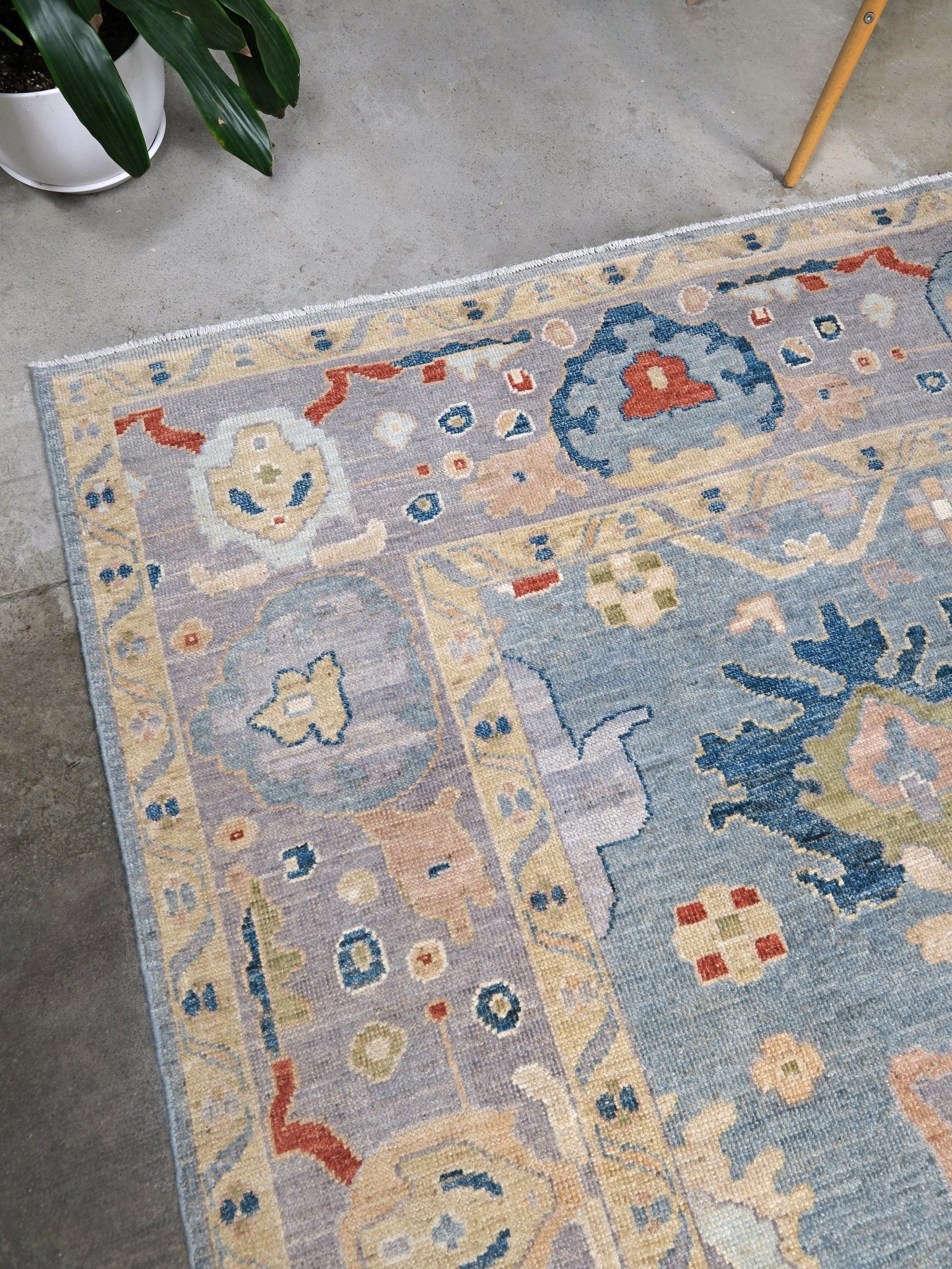 Powder blue Turkish Oushak rug with pale lavender border, warm ivory floral motifs, hand-knotted wool area rug 8x10 from Indigo Rugs Burlingame Bay Area.