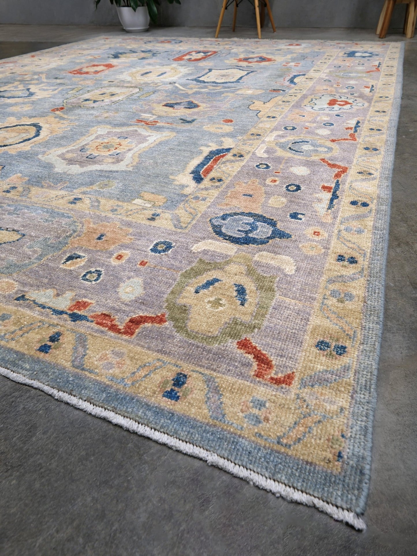 Powder blue Turkish Oushak rug with pale lavender border, warm ivory floral motifs, hand-knotted wool area rug 8x10 from Indigo Rugs Burlingame Bay Area.