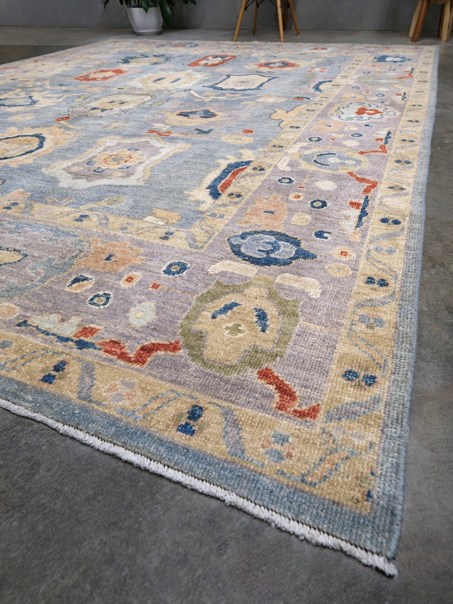 Powder blue Turkish Oushak rug with pale lavender border, warm ivory floral motifs, hand-knotted wool area rug 8x10 from Indigo Rugs Burlingame Bay Area.